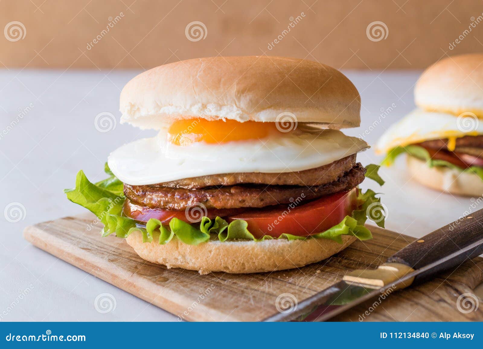 Homemade Double Hamburger with Egg, Lettuce and Tomatoes. Stock Photo ...