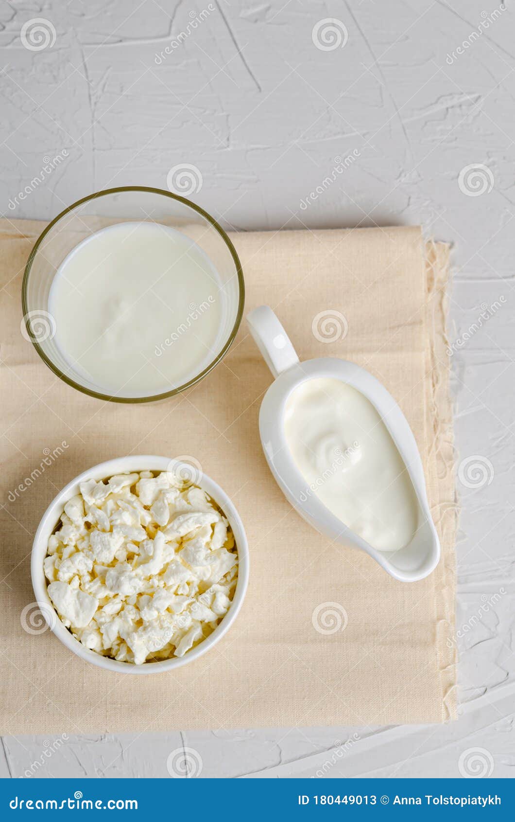 homemade fermented drink in a glass of kefir, cottage cheese on a white background, copy space, top view