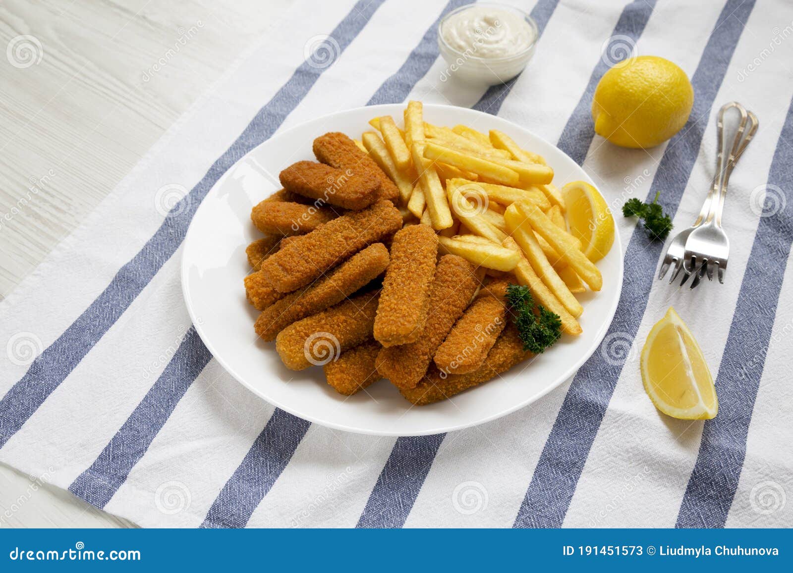 Homemade Fish Sticks and French Fries with Tartar Sauce on a White ...