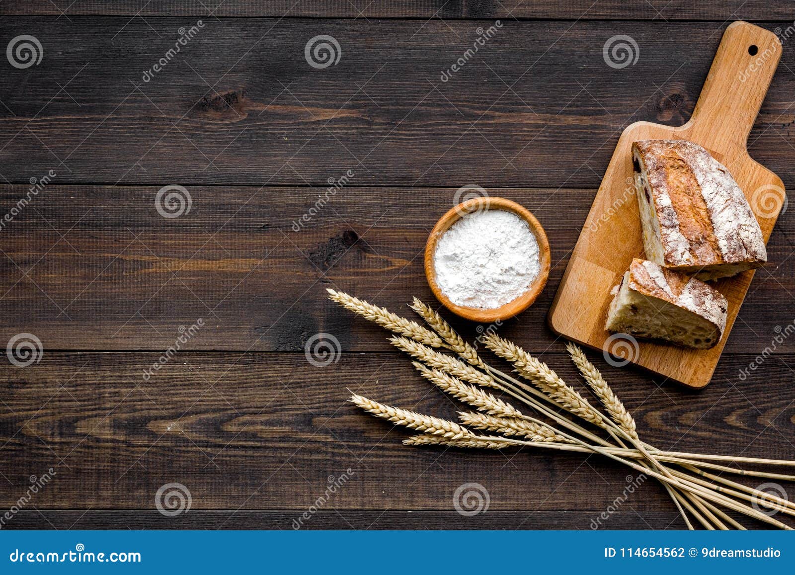 Homemade Fresh Bread Sliced On Cutting Board On Dark Wooden Background Homemade Fresh Bread Sliced On Cutting Board On Dark Wooden Background