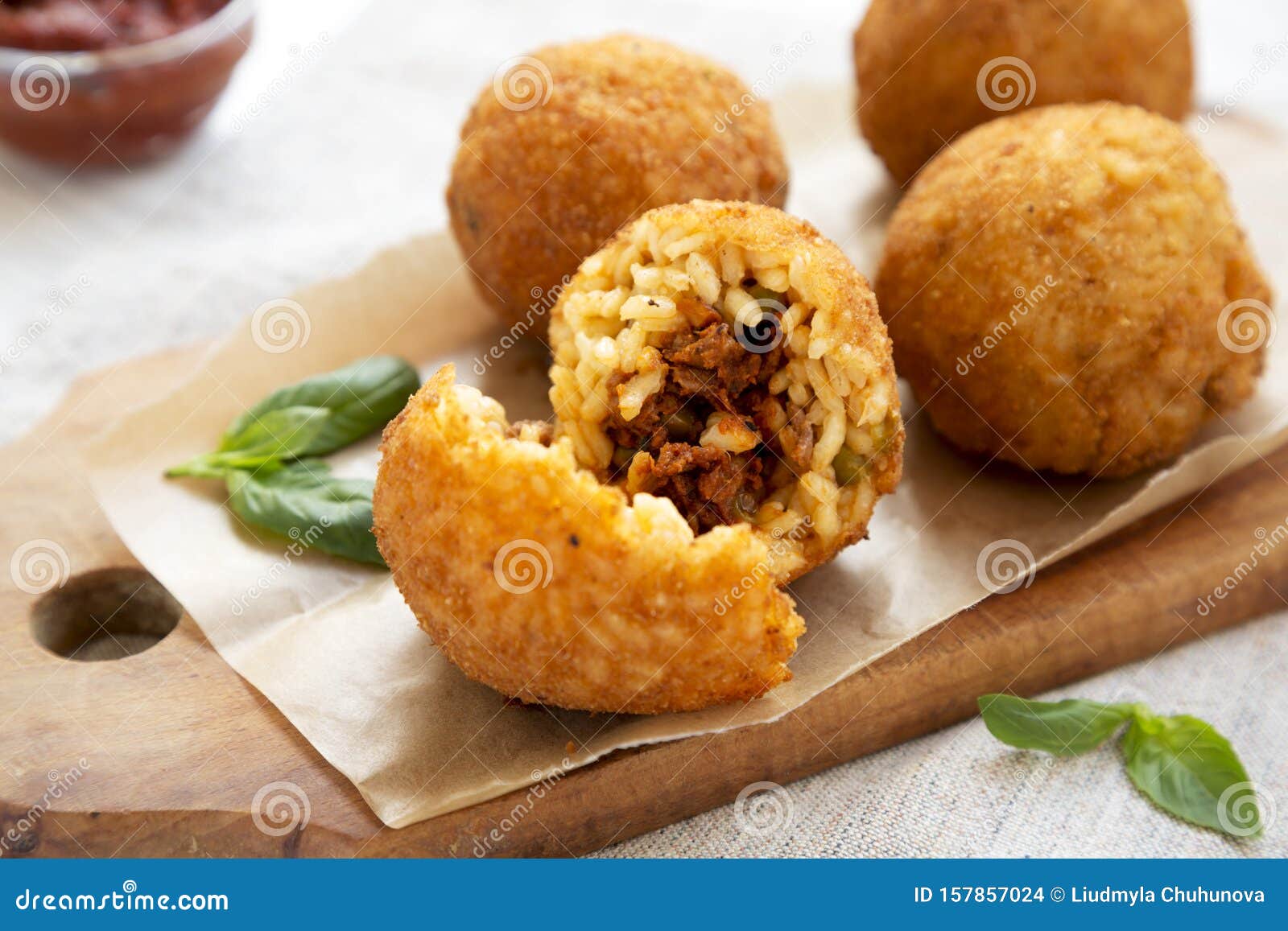 Homemade Fried Arancini With Basil And Marinara On A White Wooden
