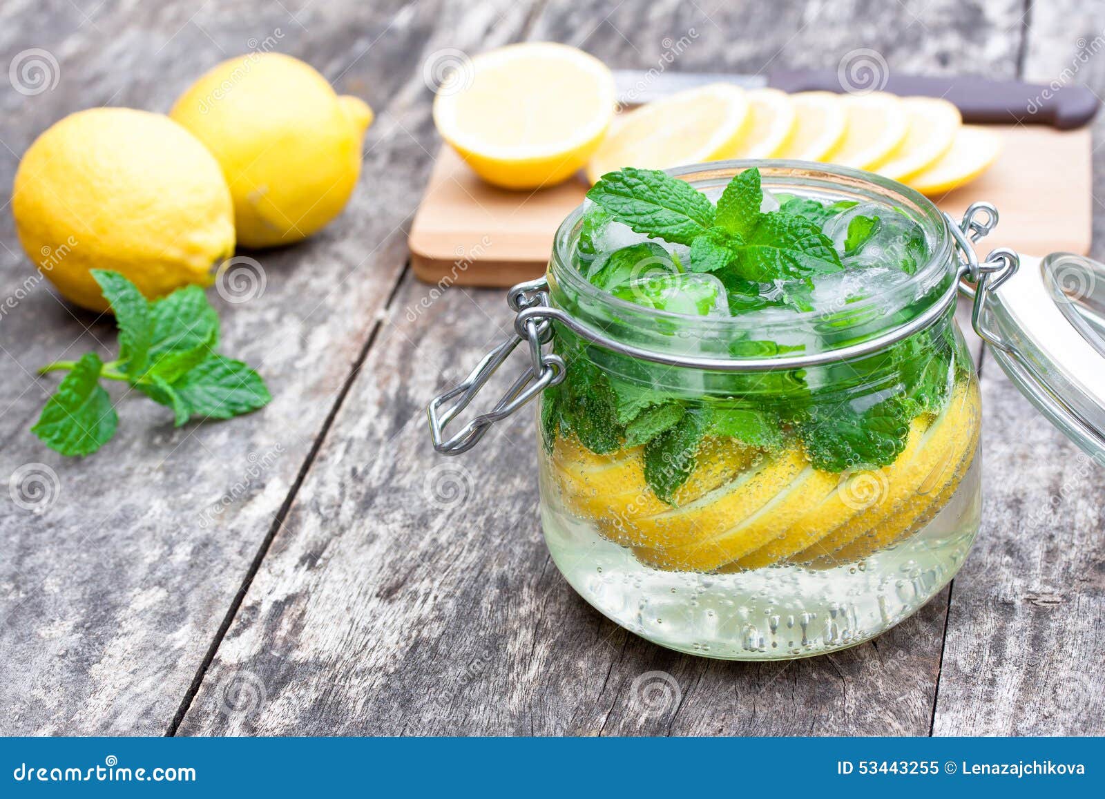 Homemade Fruit Drink with Lemon Mint and Ice on the Table Stock Image