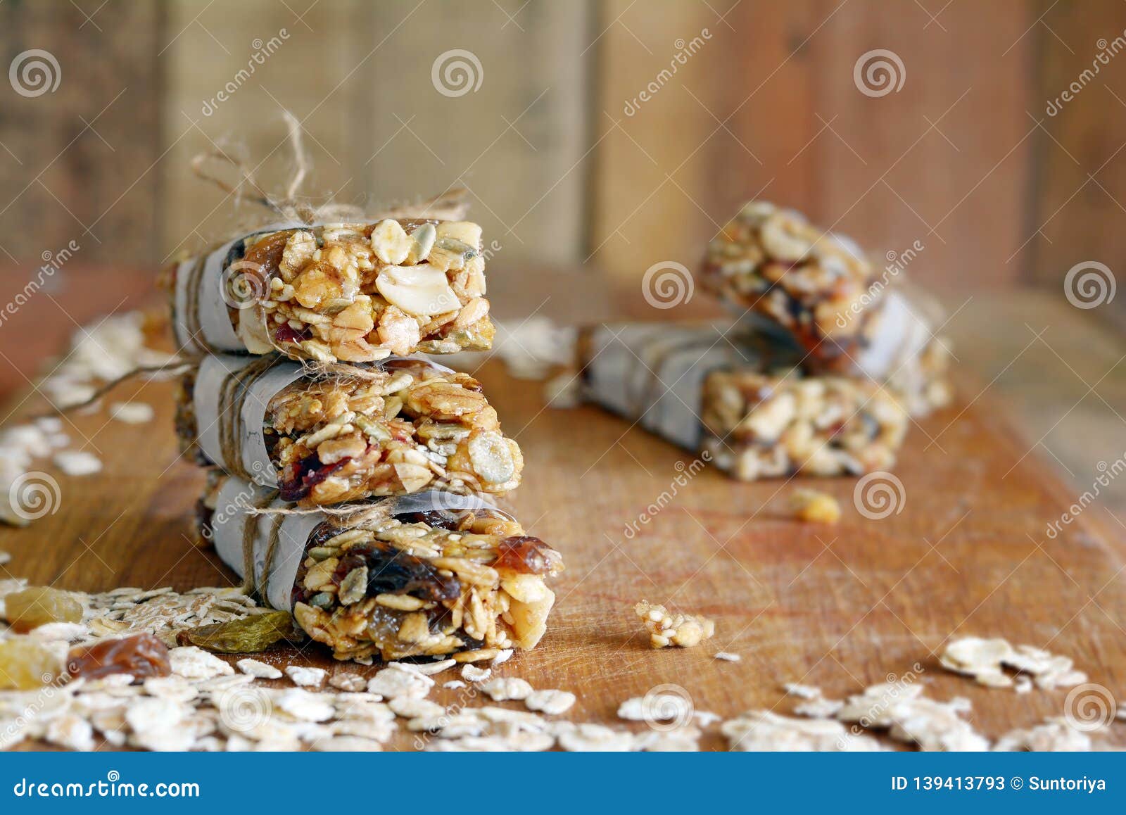 homemade granola energy bars with figs, oatmeal, almond, dry cranberry, dates, nuts, raisins, sesame and healthy snack
