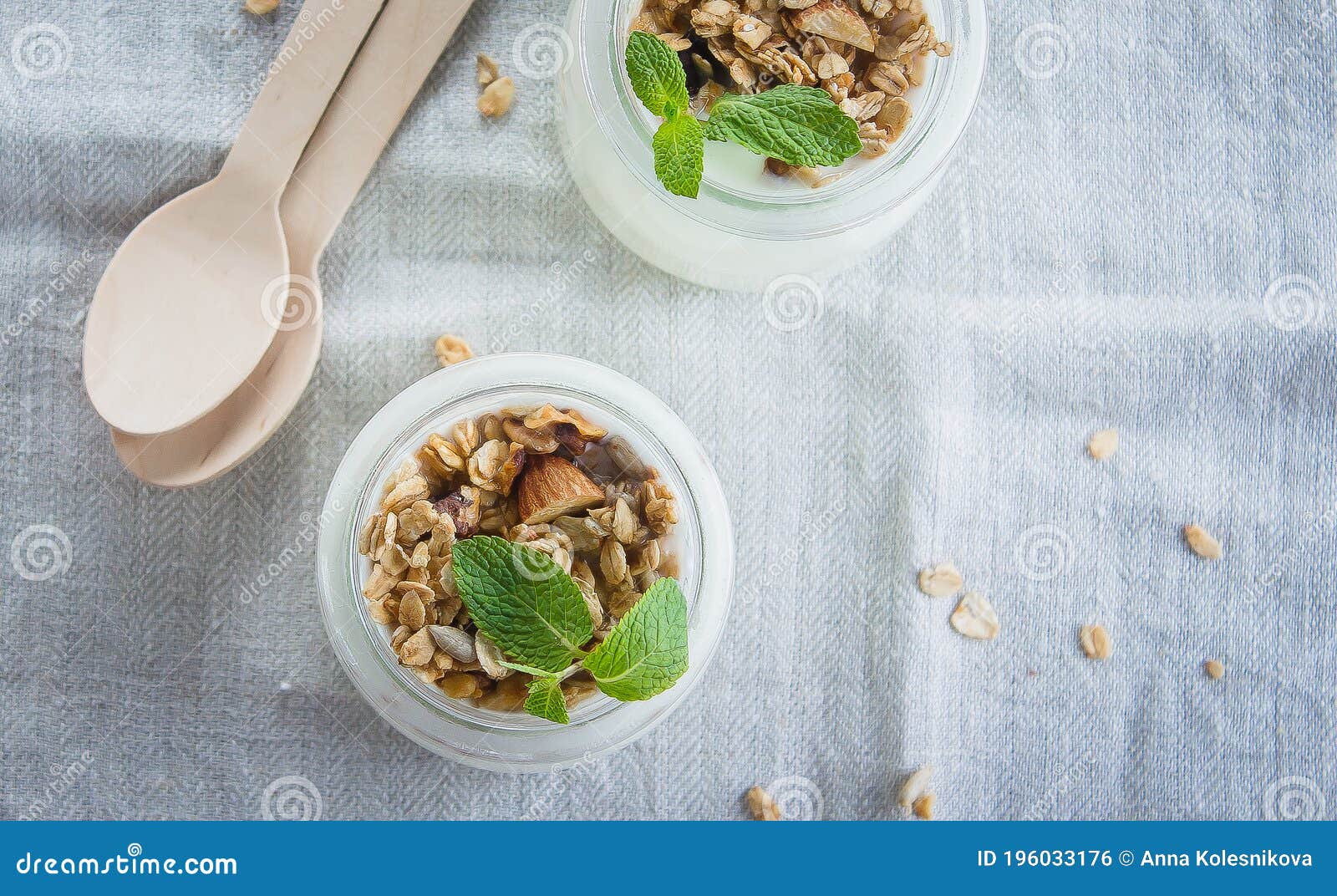 homemade granola with greak yogurt in a glass jar. healthy food concept. top view, copy space