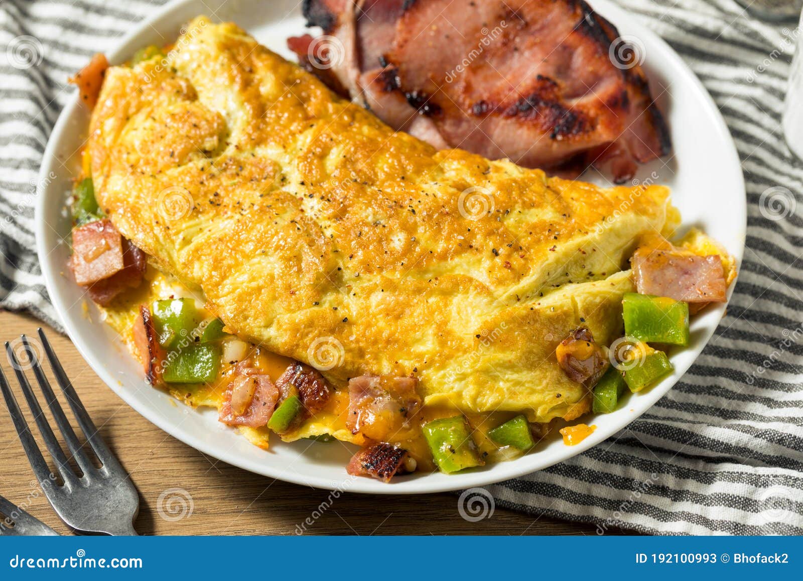 Denver Omelette And Ranch Potatoes In Cast Iron Skillet On Table Stock