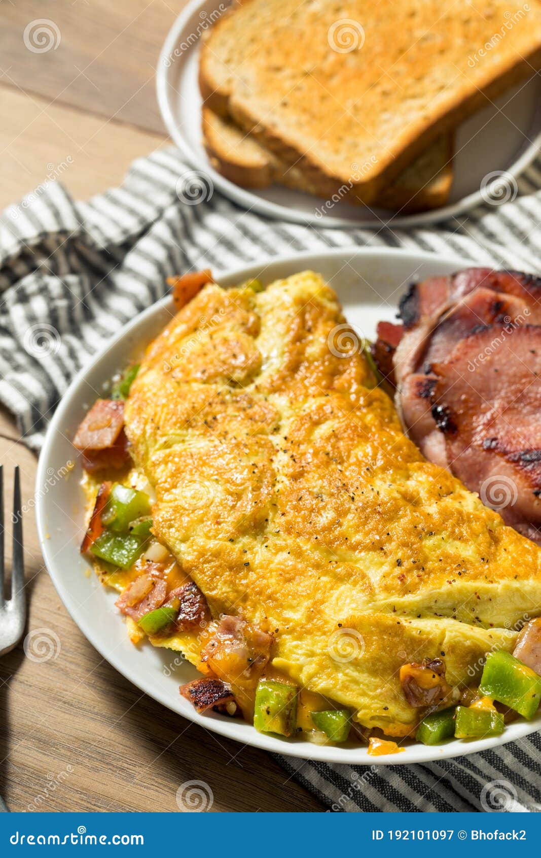 Denver Omelette And Ranch Potatoes In Cast Iron Skillet On Table Stock