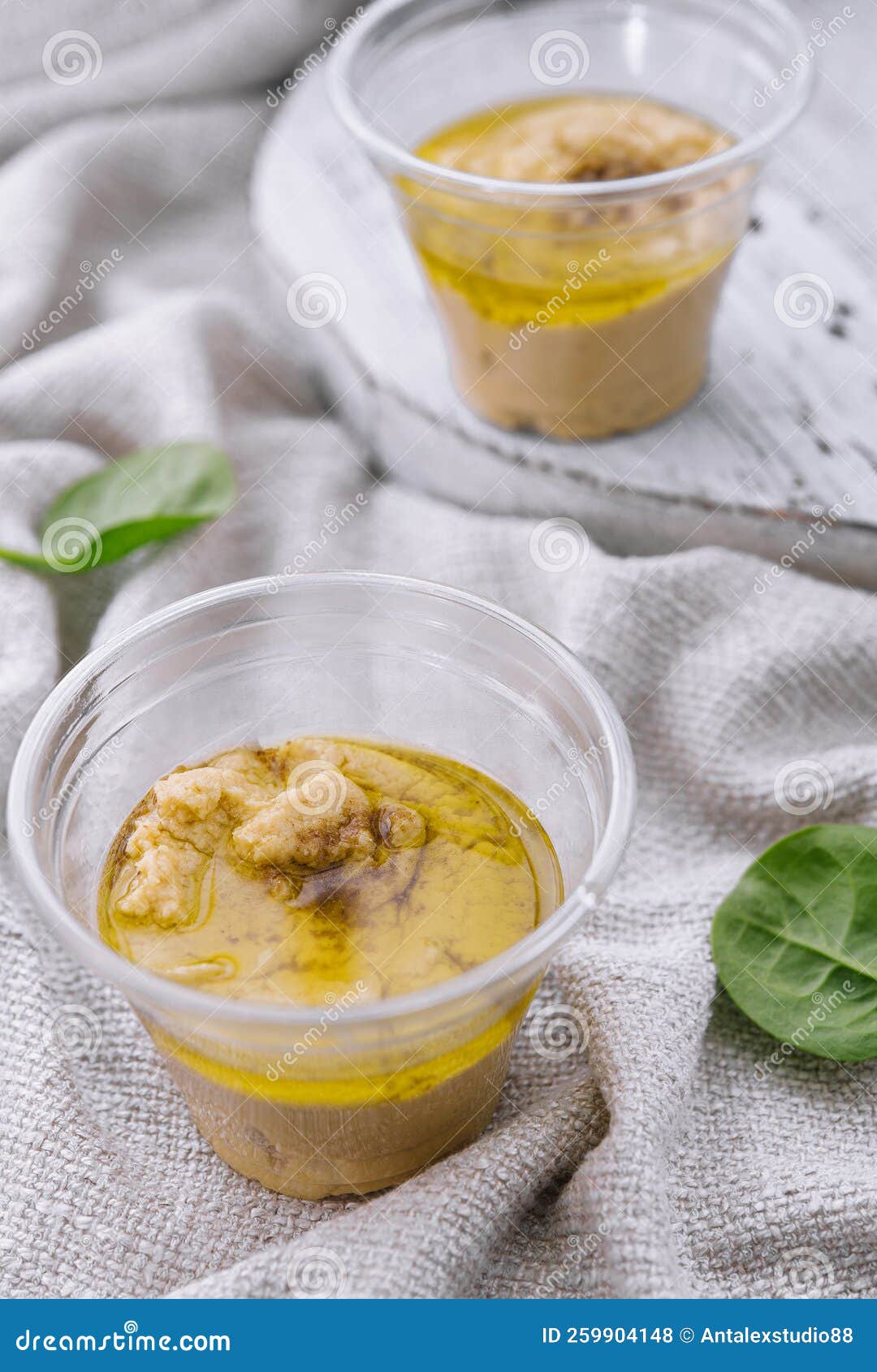 Hummus in a Plastic Cups with Basil Stock Photo Image of sesame