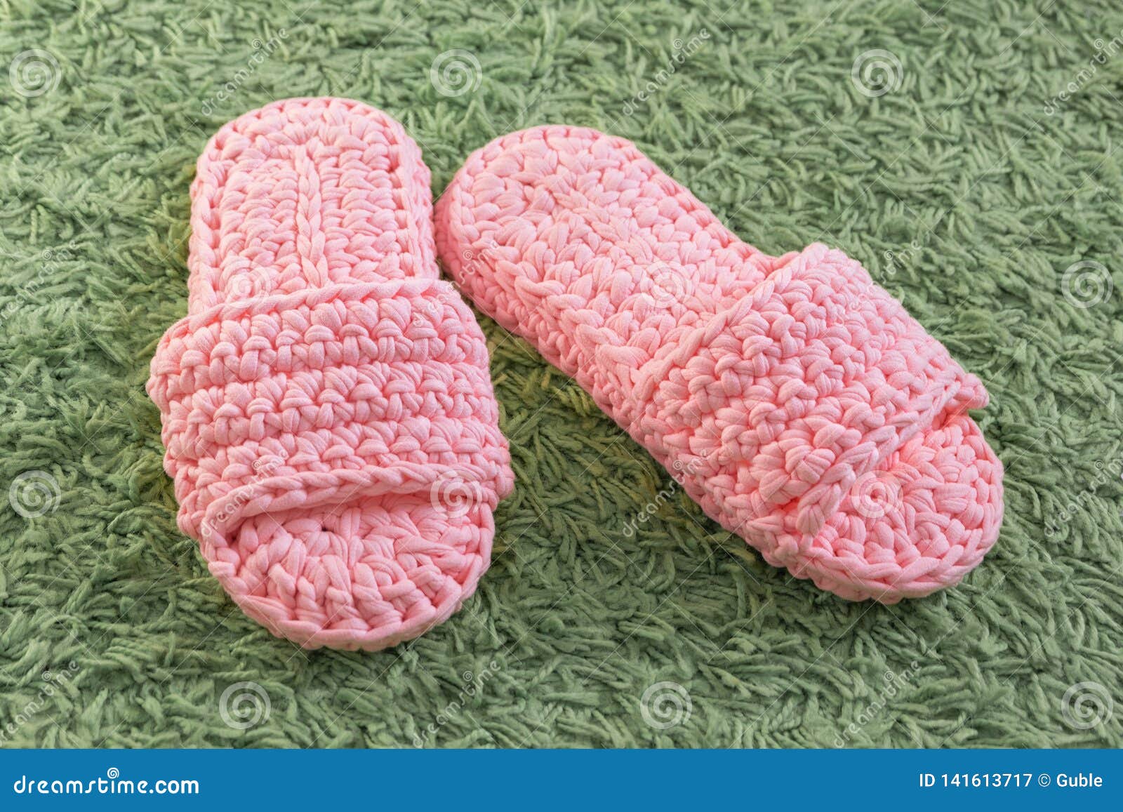 Homemade Knitted Bedroom Slippers on Fluffy Green Carpet Stock Image ...