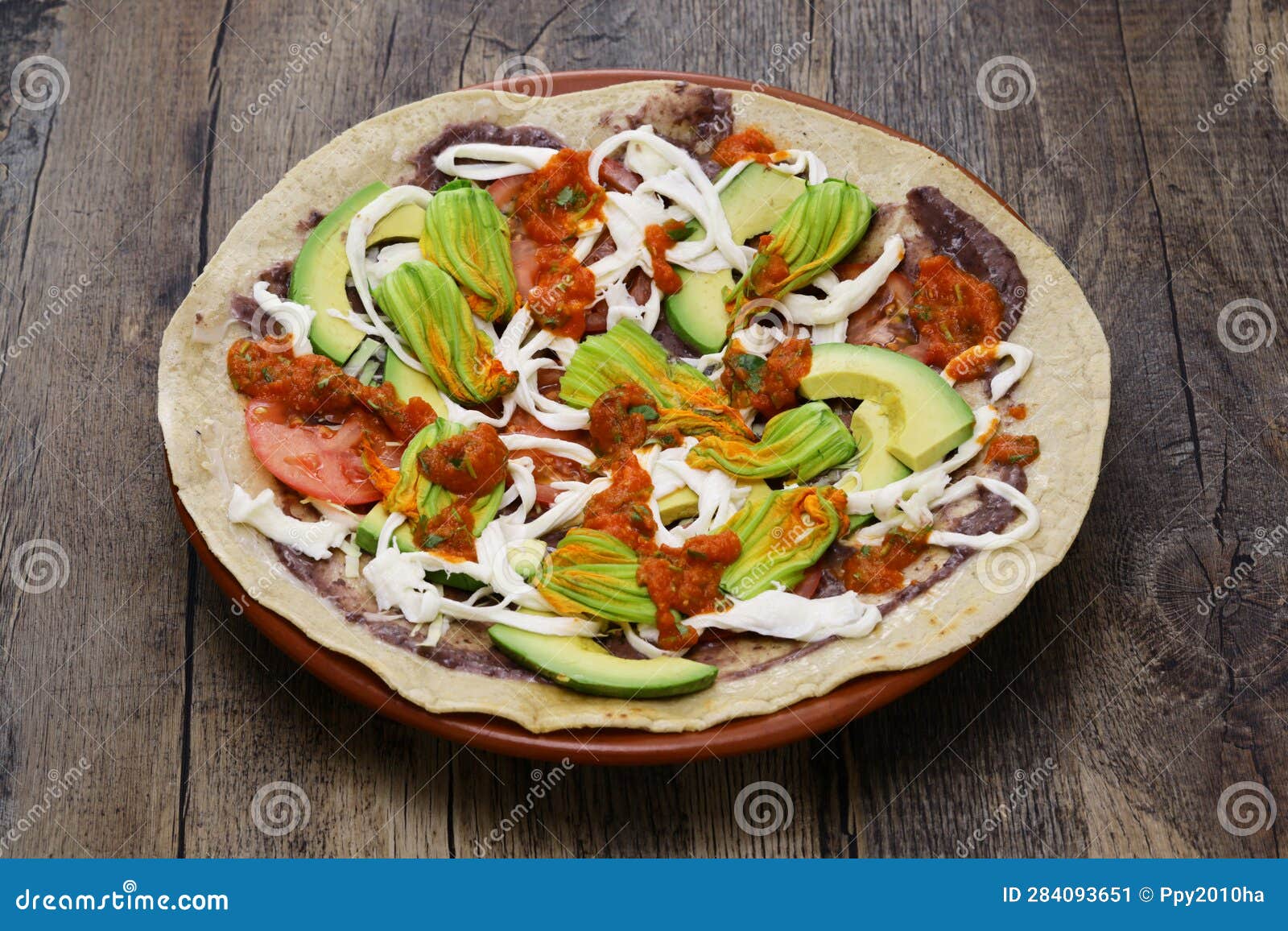 homemade open face vegetable tlayuda(before charcoal grilling), mexican pizza