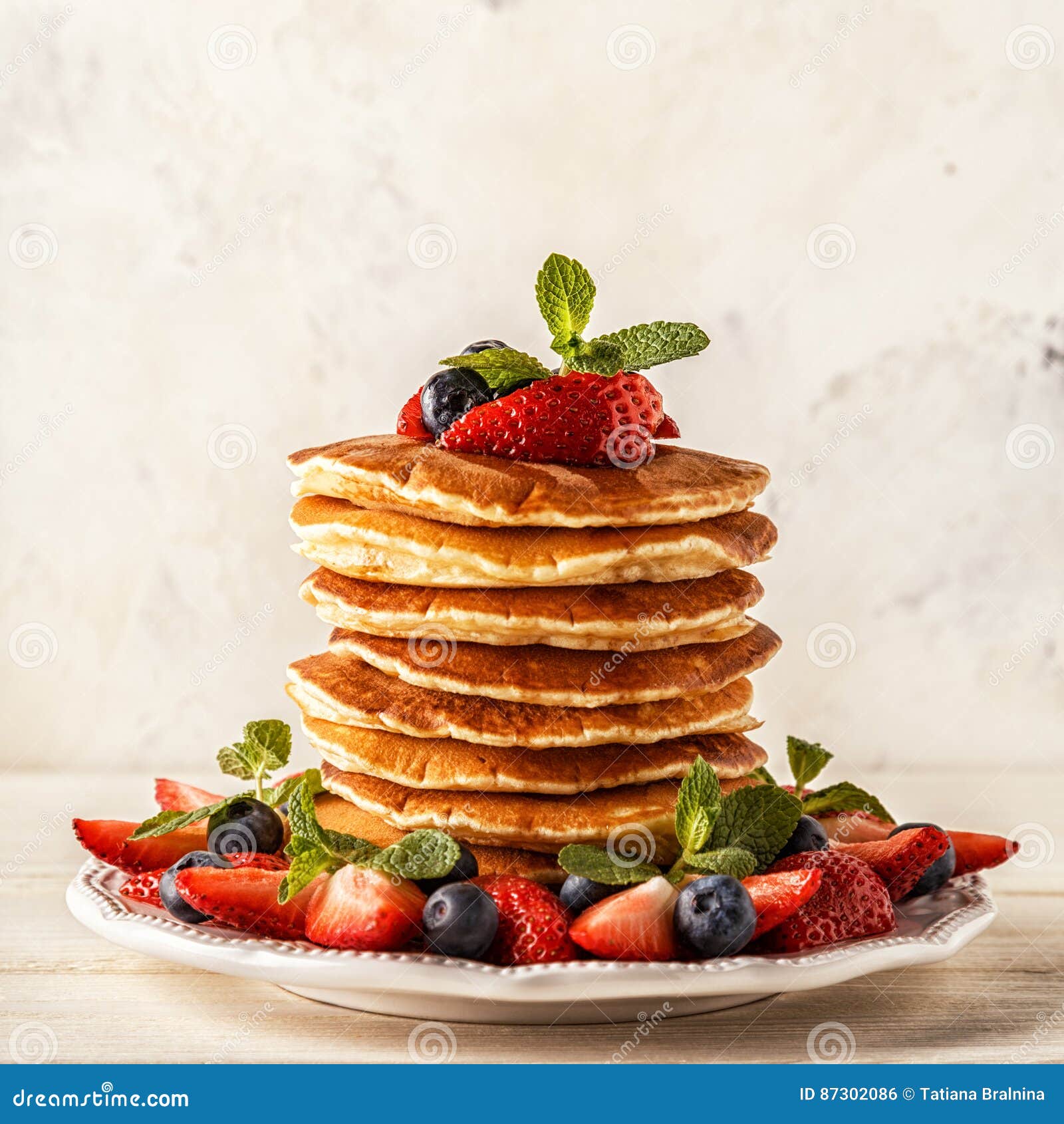 Homemade Pancakes With Berries And Fruit On A White Background. Stock ...