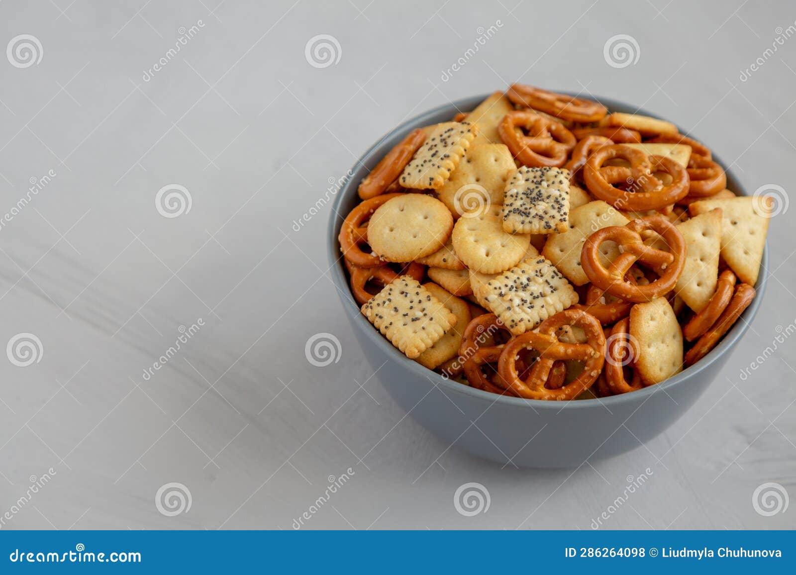 Homemade Party Snack Mix With Crackers And Pretzels In A Bowl Side homemade-party-snack-mix-with-crackers-and-pretzels-in-a-bowl-side