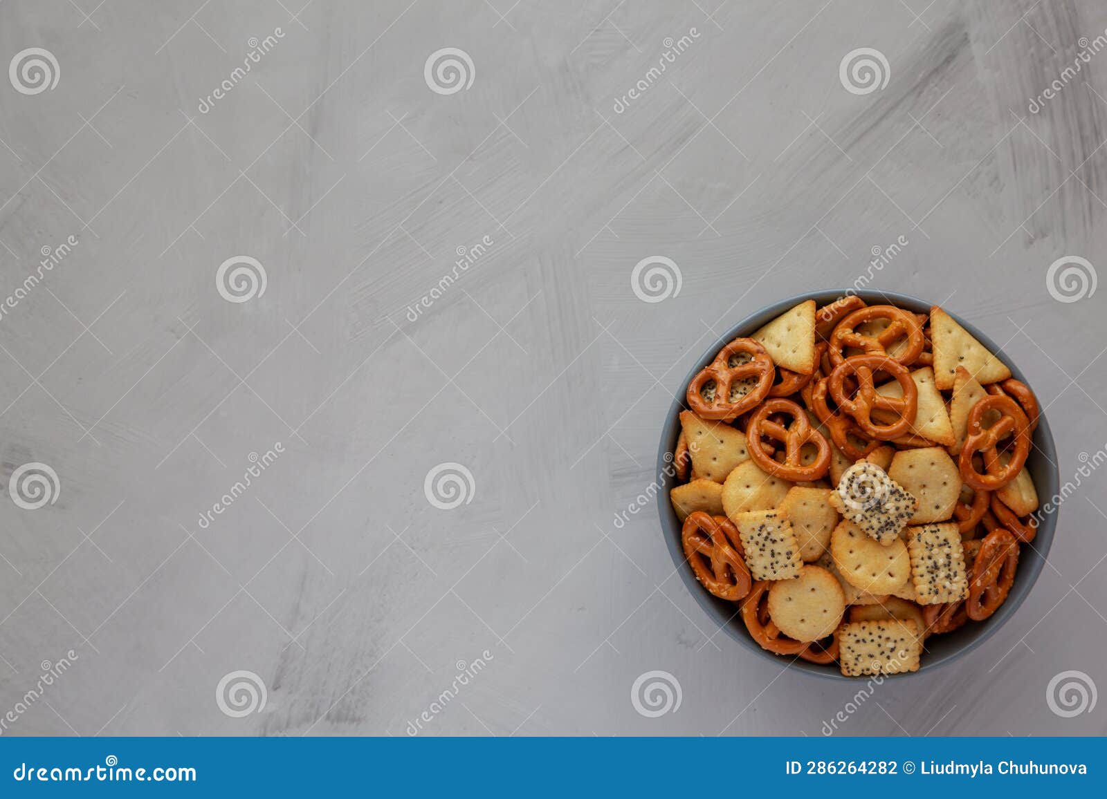 Homemade Party Snack Mix With Crackers And Pretzels In A Bowl Top View homemade-party-snack-mix-with-crackers-and-pretzels-in-a-bowl-top-view