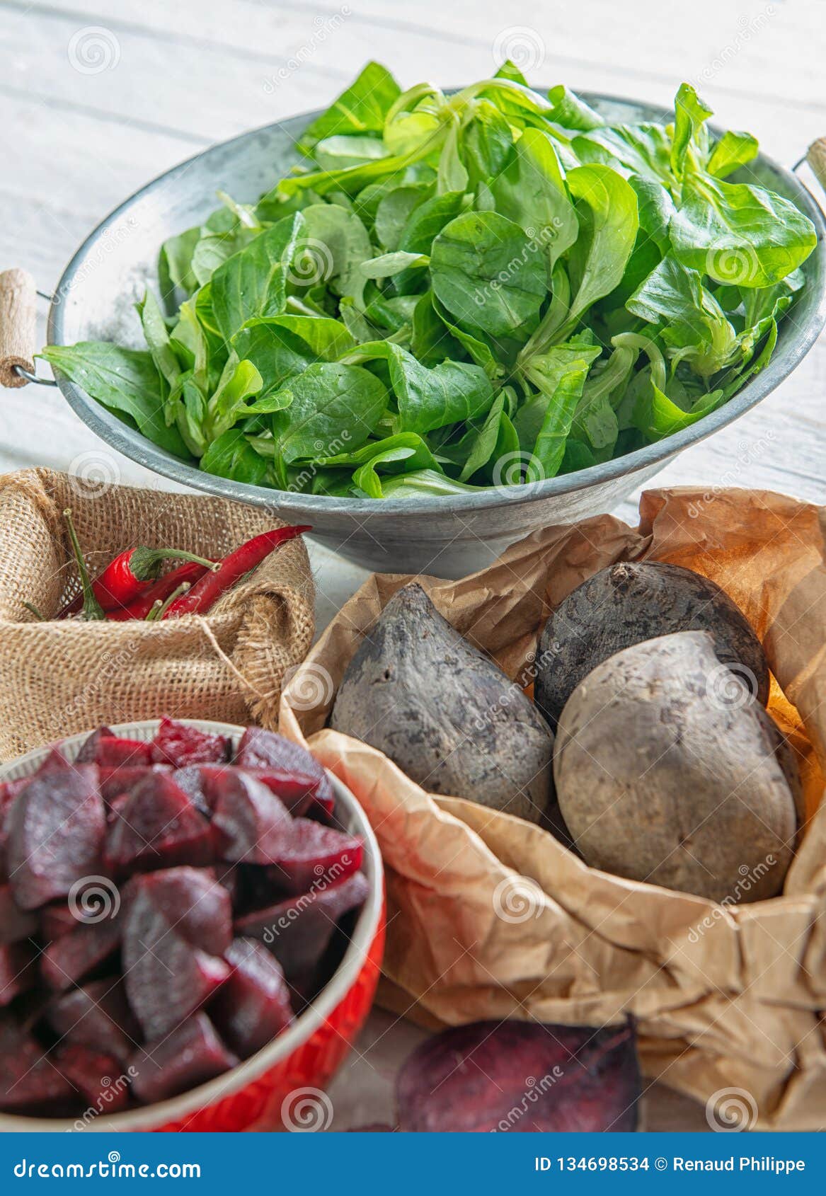 Homemade Raw Beetroot Salad in Small Bowl with Green Salad Stock Photo