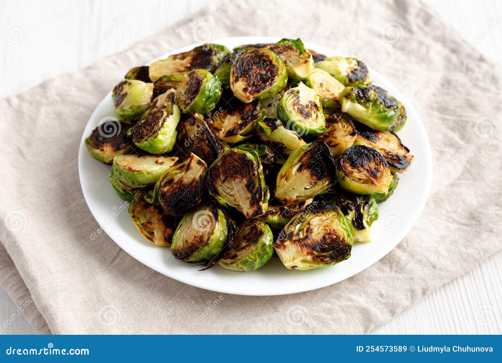 Homemade Roasted Brussel Sprouts on a Plate, Side View Stock Image