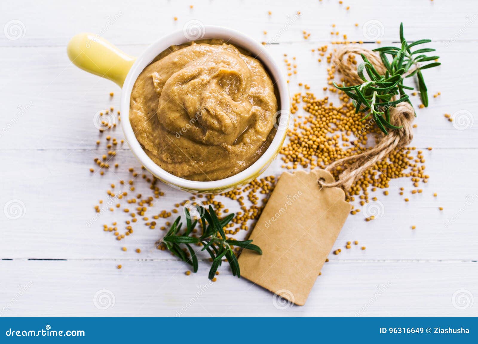 Homemade spicy mustard sauce wooden background. Selective focus.