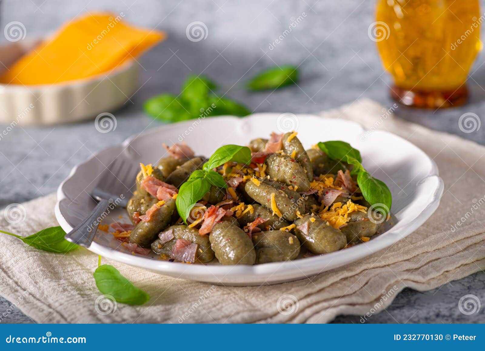 Spinach gnocchi with ham stock photo. Image of plate 232770130