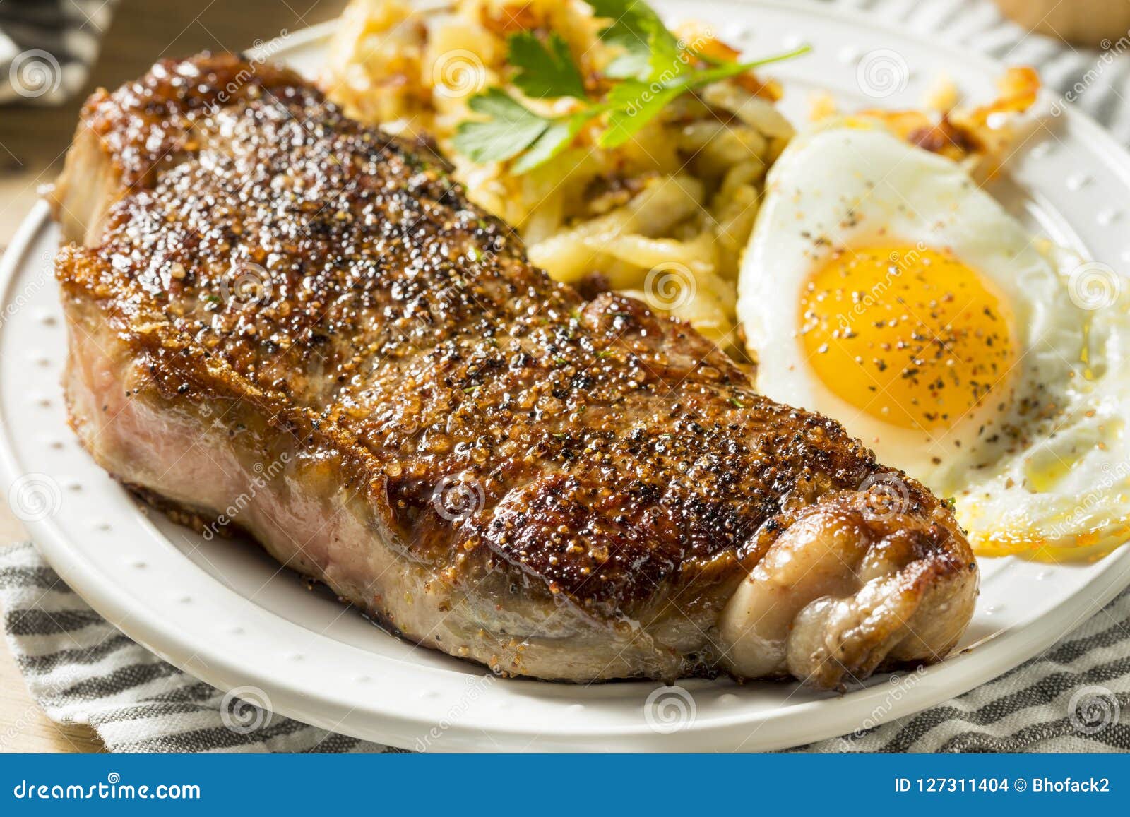 Homemade Steak and Eggs Breakfast Stock Photo - Image of food, onion