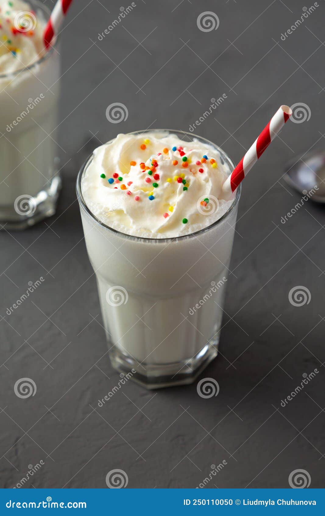 Homemade Vanilla Milk Shake with Whipped Cream, Side View Stock Photo