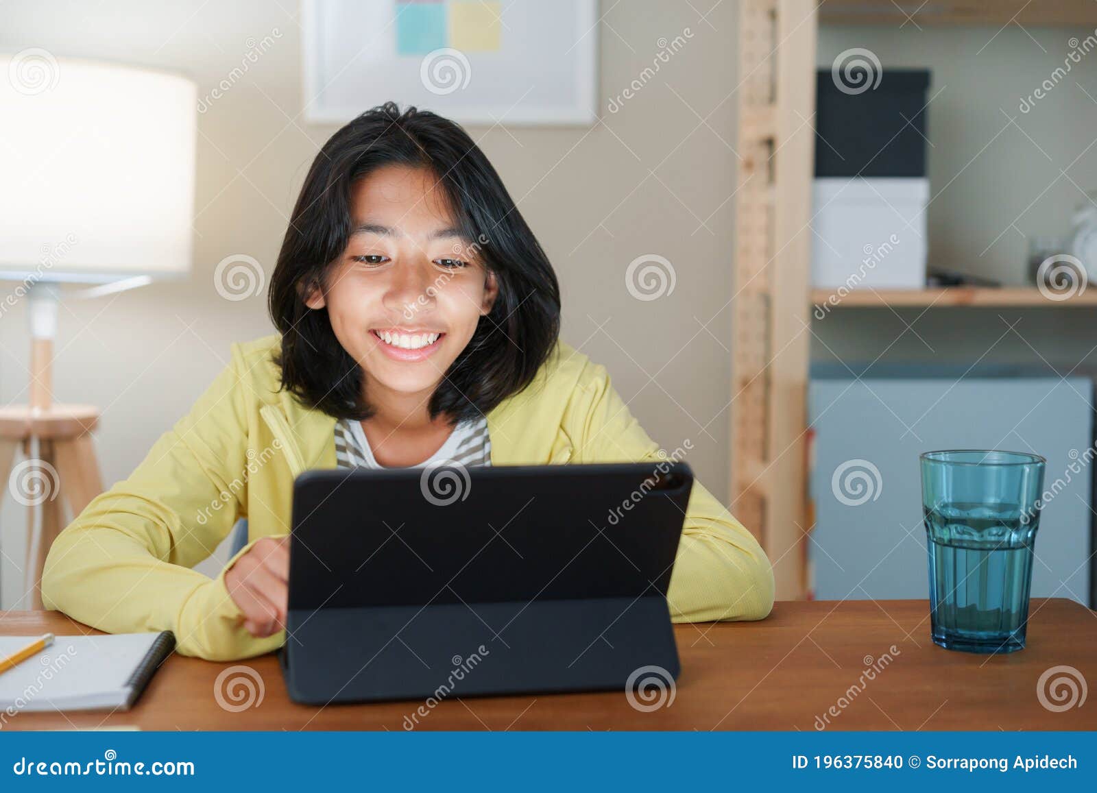 Homeschooling Asian Girl Doing Homework And Online Learning Wit