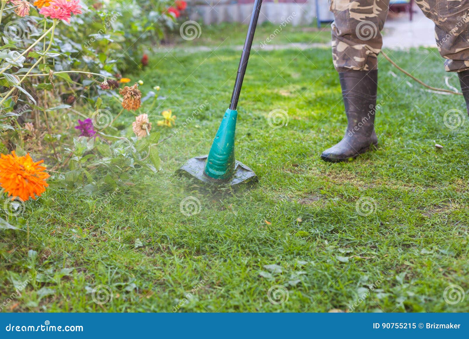 Caoutchouc Homme Dans Faucheuse Devant Une Des L Avec Bottes En IP1ZqPw