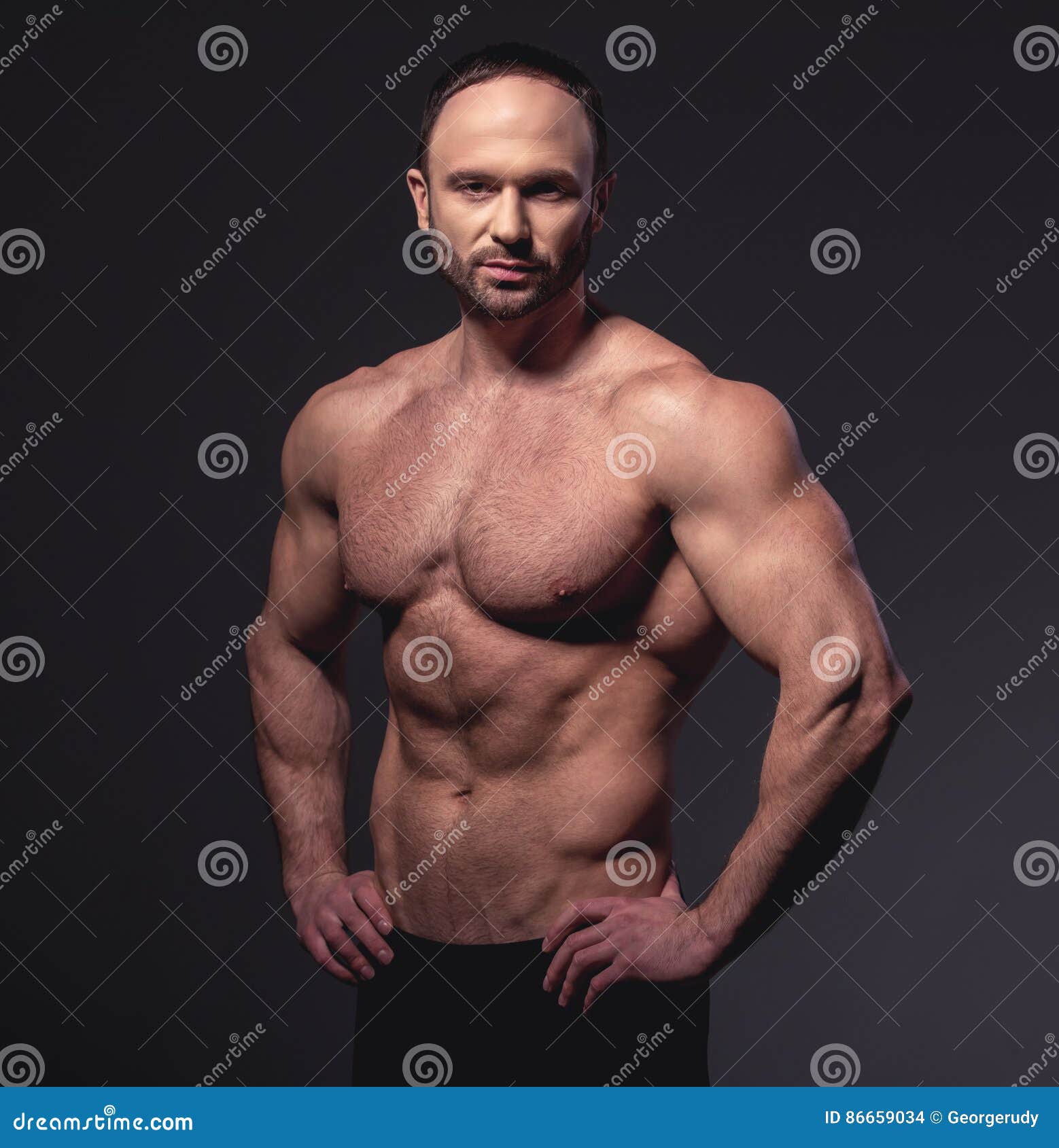 Homme musculeux bel photo stock. Image du fuselage, muscle - 86659034