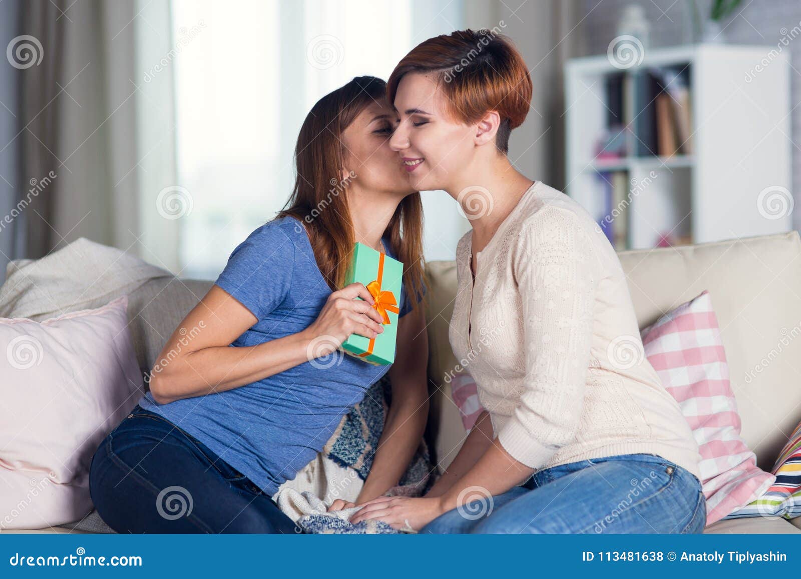 Lesbian Girls Kissing On The Sofa