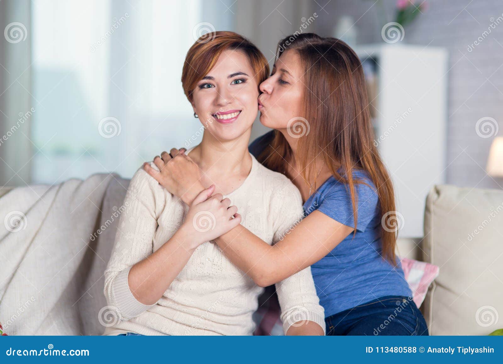 Lesbians Kissing On Couch