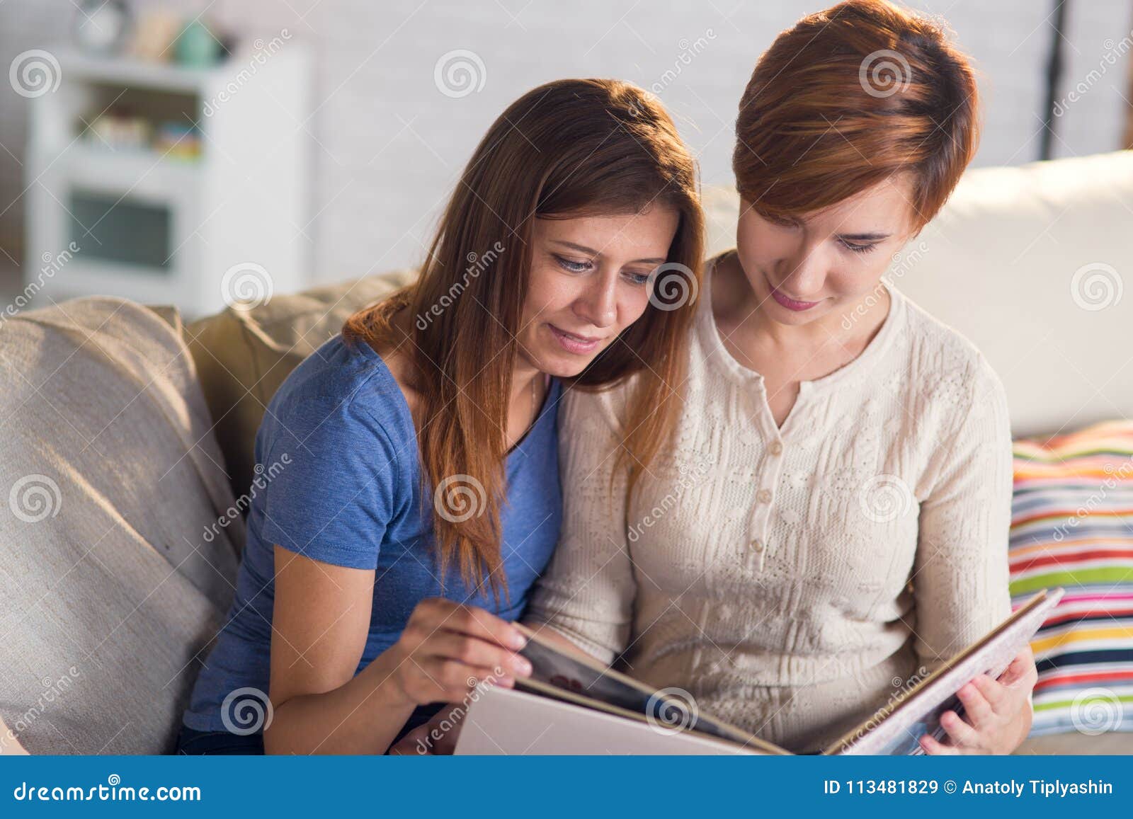 Homosexual Couple Of Lesbian Women At Home On The Couch Watching Stock Image Image Of Marriage 