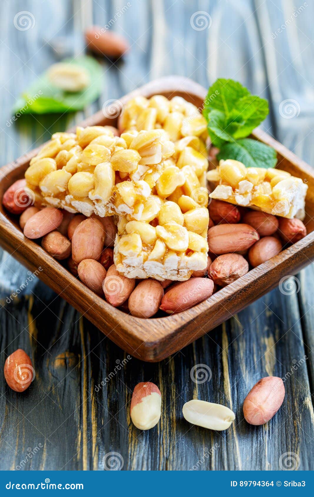 Honey Bars with Peanuts in Bowl with a Whole Peanut. Stock Photo