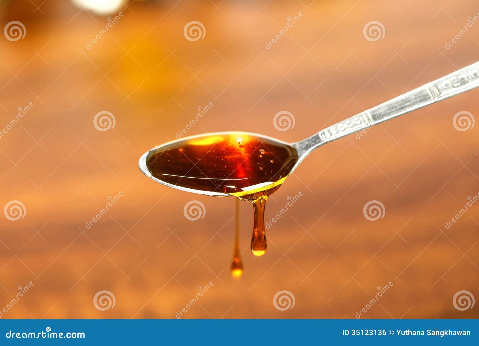 Honey on a spoon stock photo. Image of natural, concept 35123136
