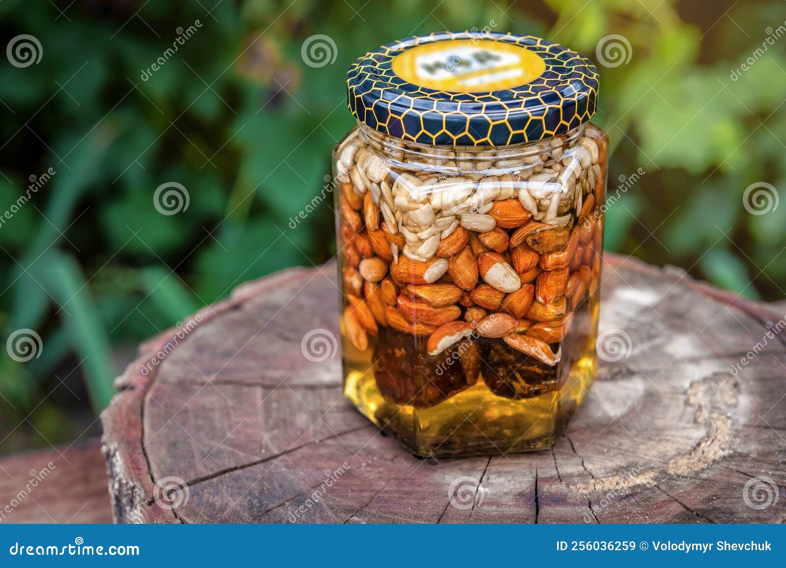 Healthy mix of natural honey with different nuts in a jar on white  background Stock Photo - Alamy