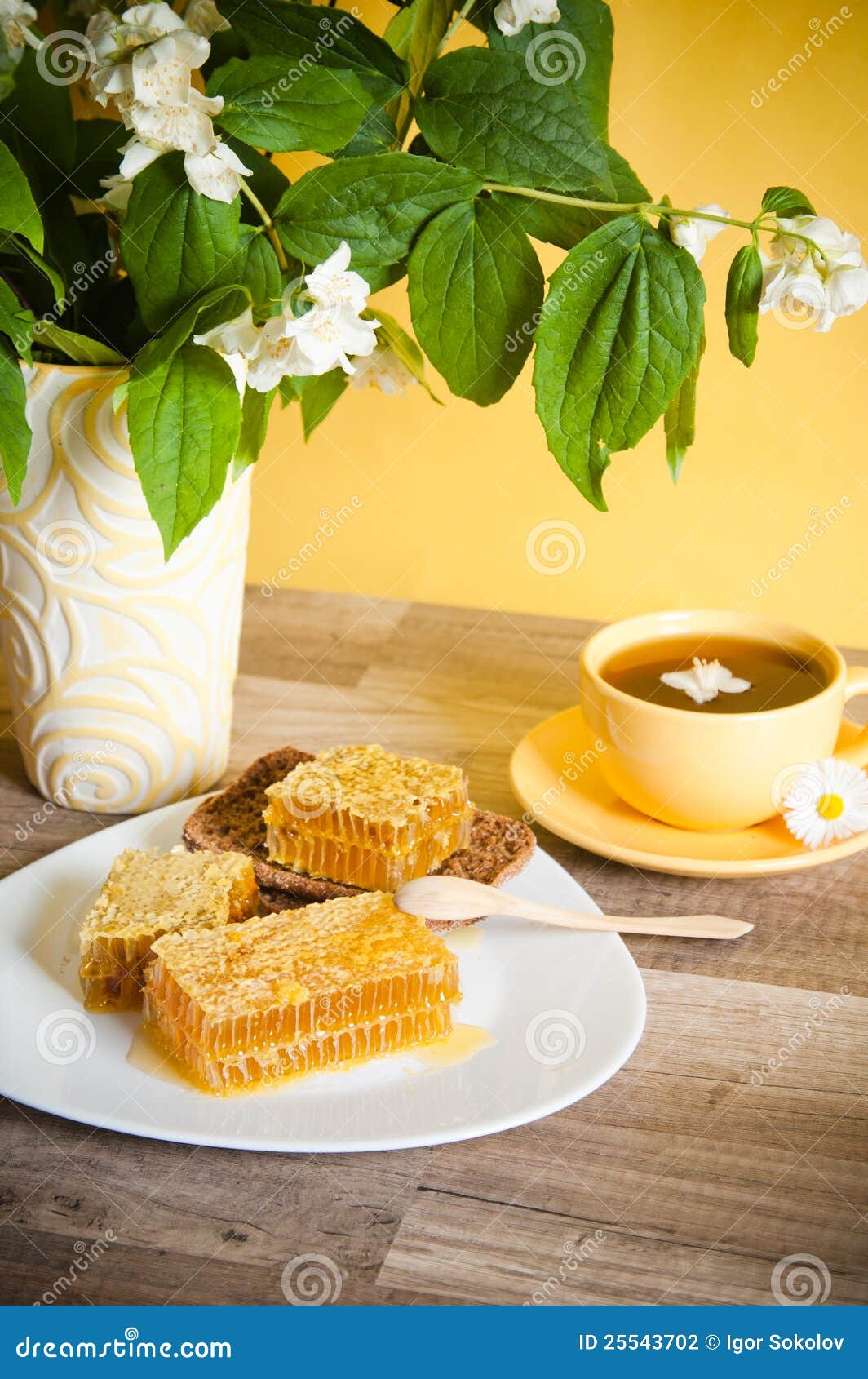 Honeycomb with a Cup of Tea Stock Photo - Image of spoon, honeycomb