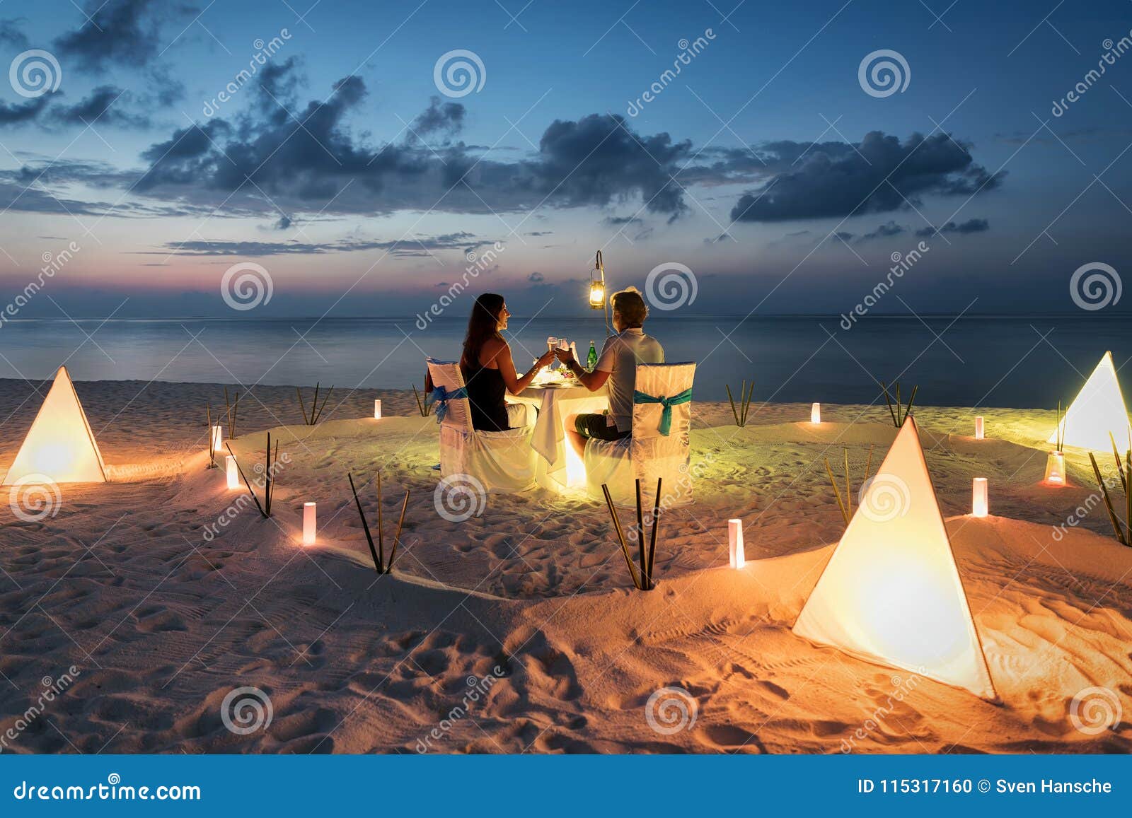 honeymoon couple is having a private, romantic dinner