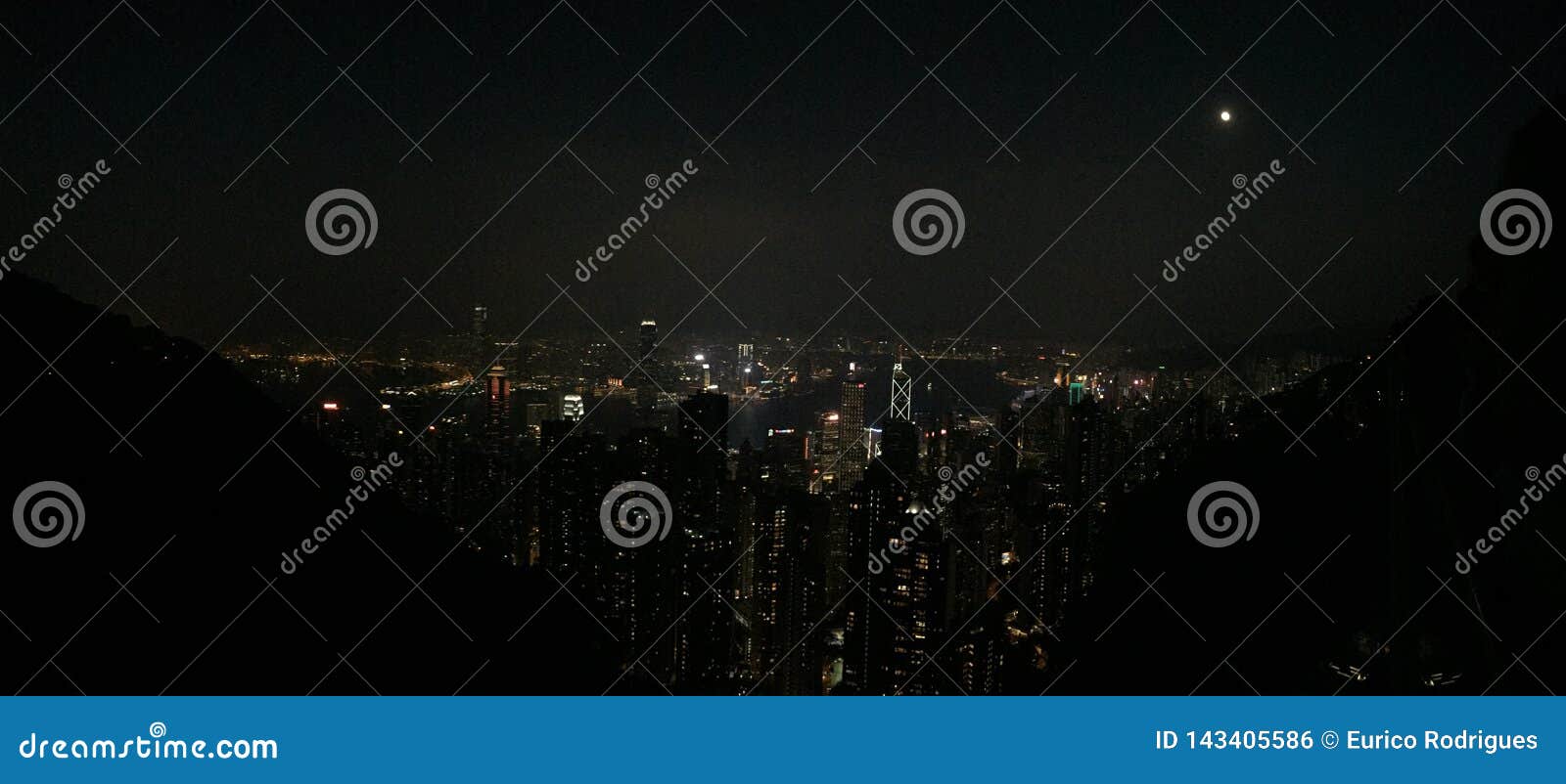 hongkong street life, tightly clustered buildings, night scene.