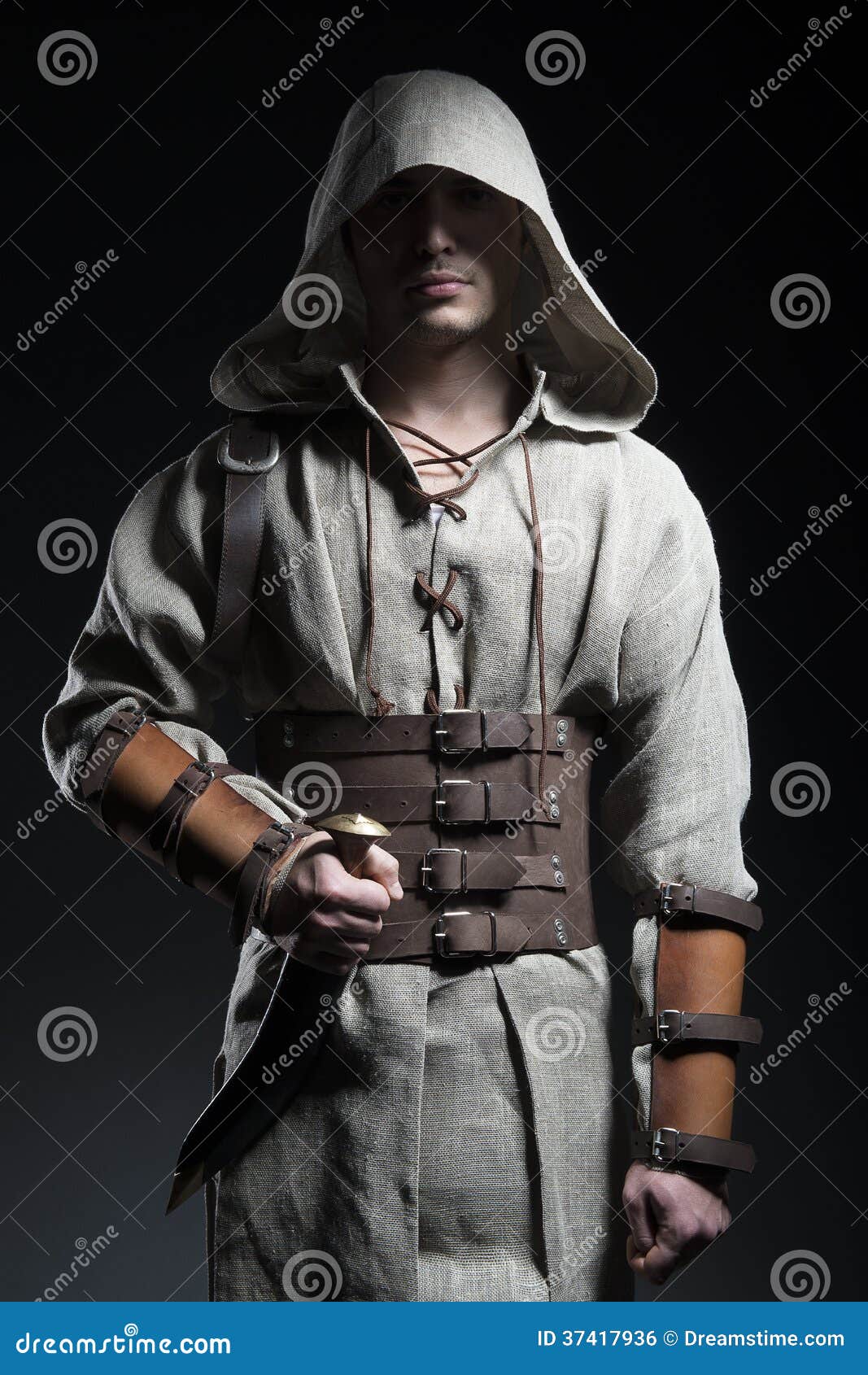 Hooded warrior with knife stock photo. Image of clothing 37417936