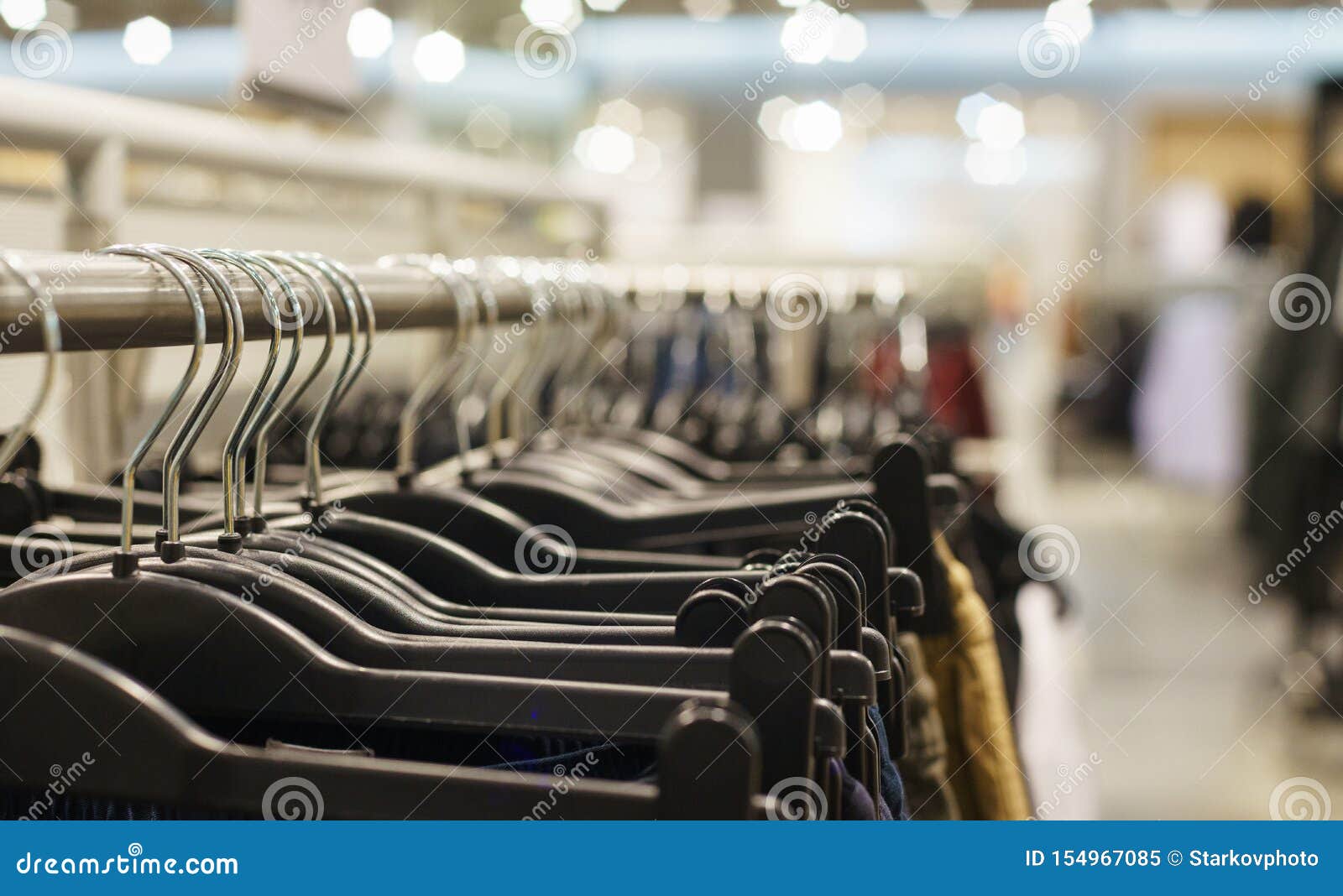 Hoodies, a Sweater and a Hoodie on a Hanger in a Fashion Store for ...