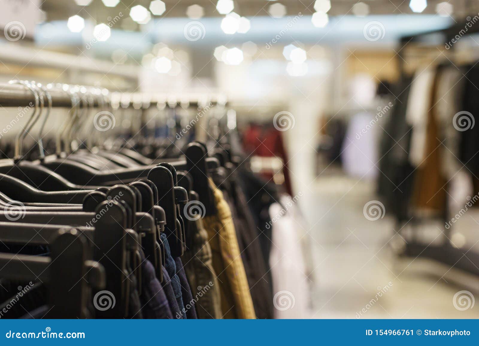 Hoodies, a Sweater and a Hoodie on a Hanger in a Fashion Store for ...