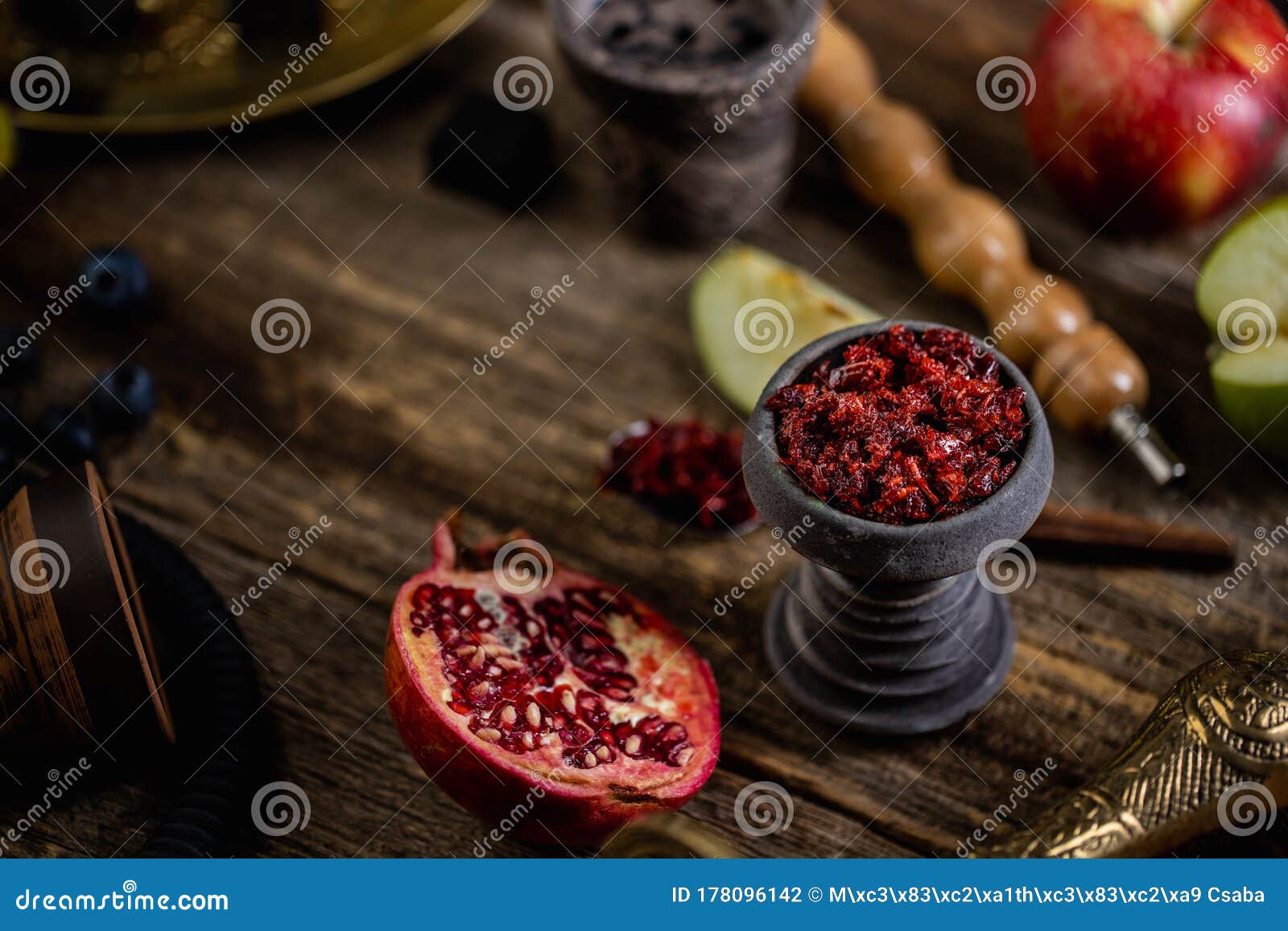 Hookah Head on Old Table with Fruit Flavoured Tobacco Stock Photo