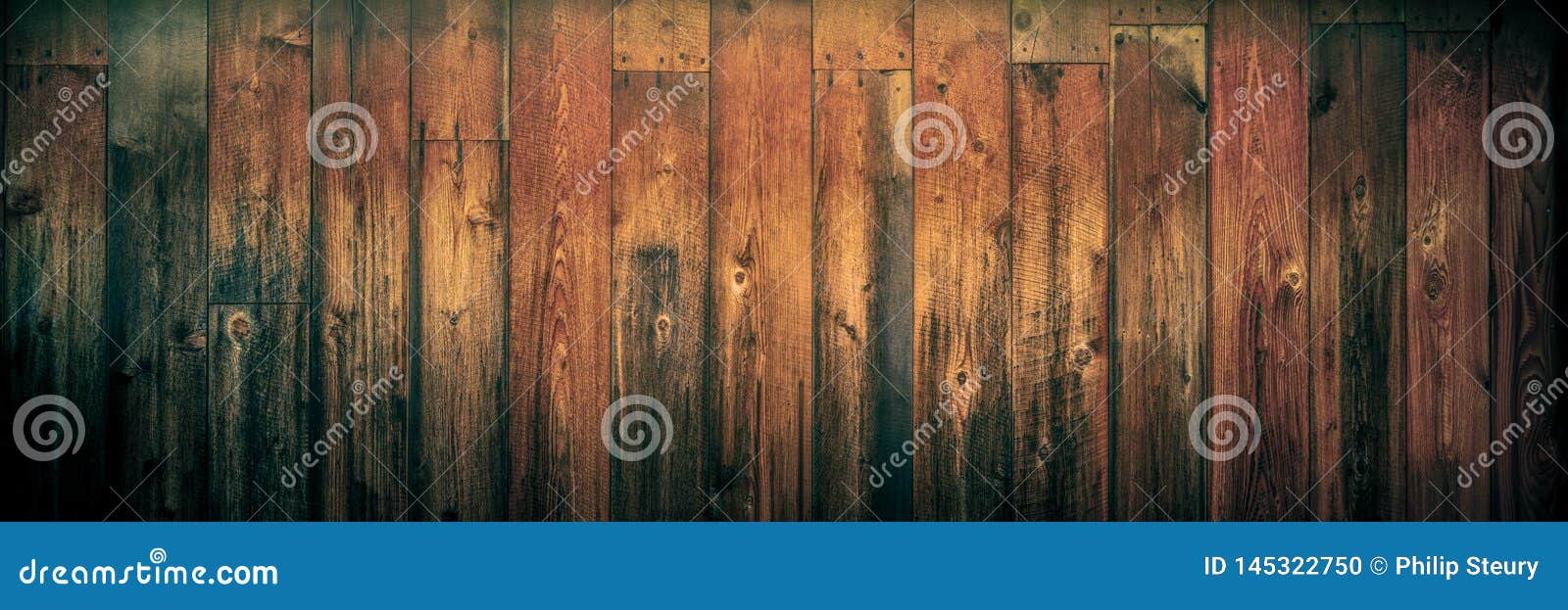 dark weathered cedar wooden background with warm vintage effect