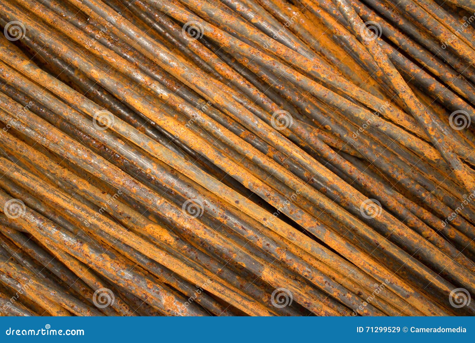 Horizontal CU of Thin Smooth Semirusty Steel Bars Stacked in a