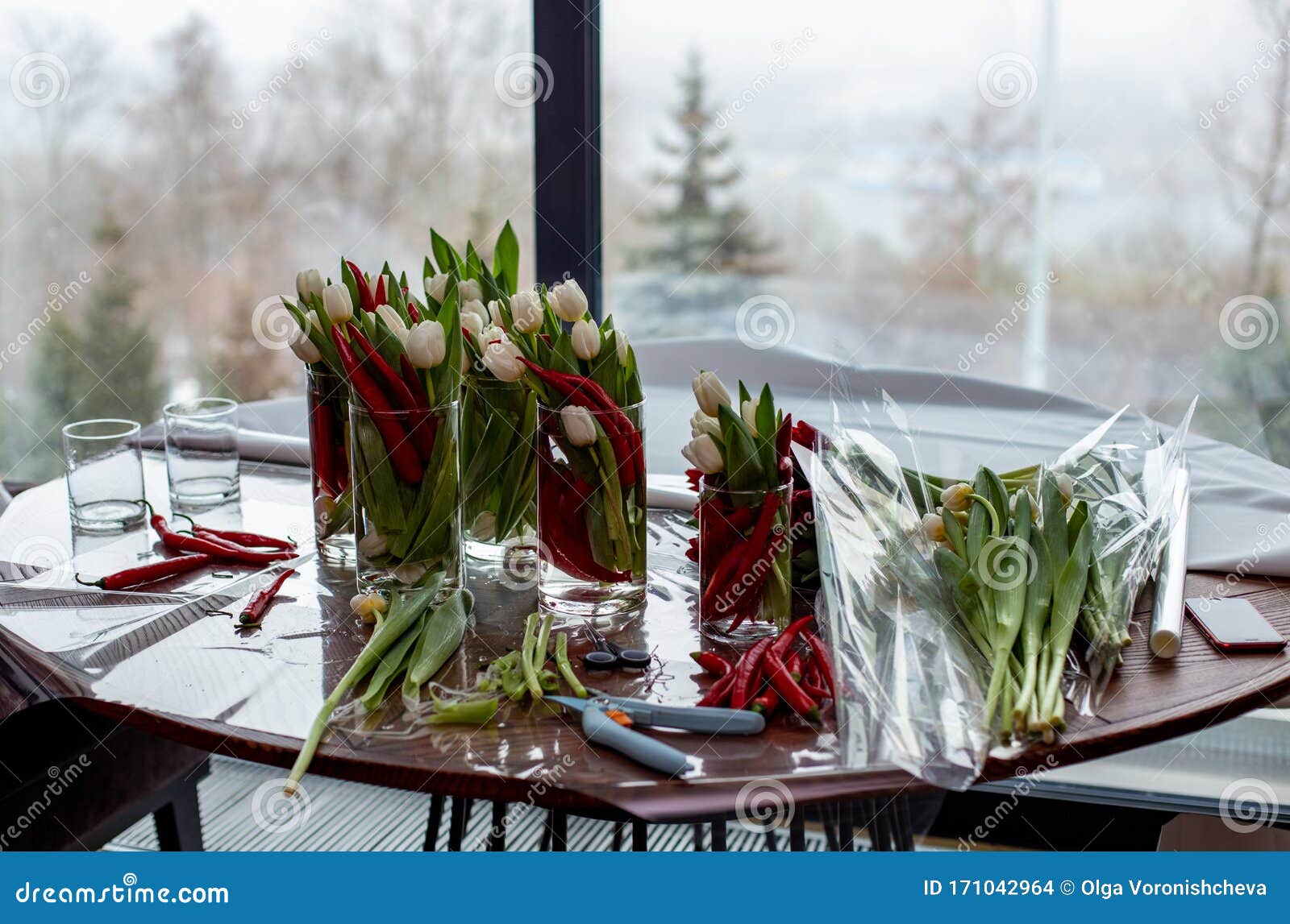 horizontal photo of a floristÃ¢â¬â¢s desktop in the process of creating flower arrangements