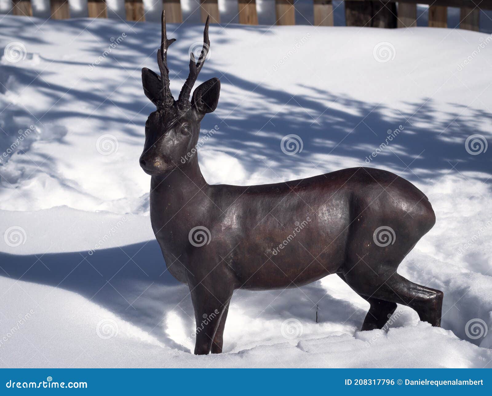 Horizontal Sculpture of Bronze Roe Deer in the Snow Stock Photo Image