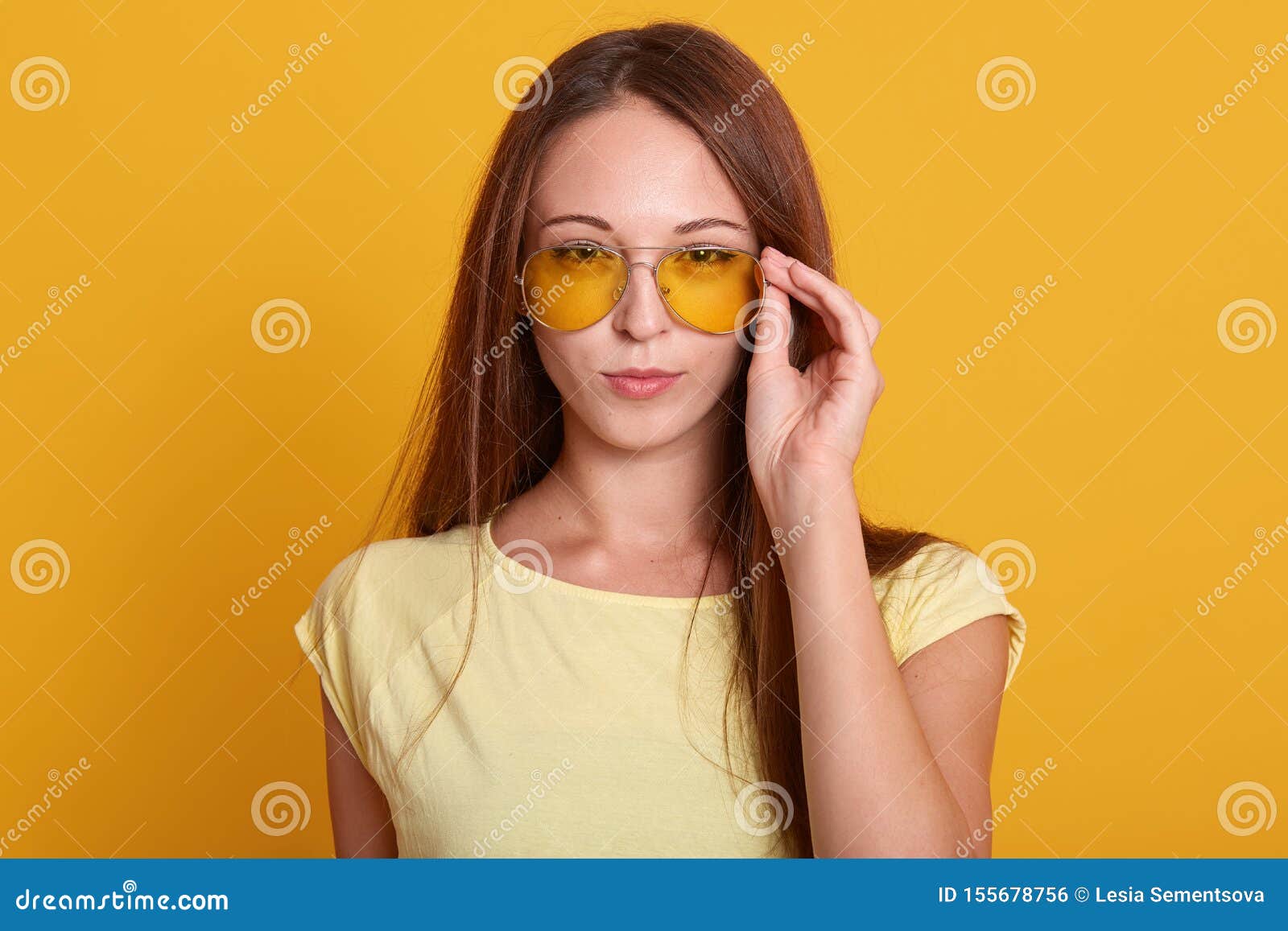 Horizontal Shot of Adorable Woman Wering Casual Outfit, Keeps Hand on ...