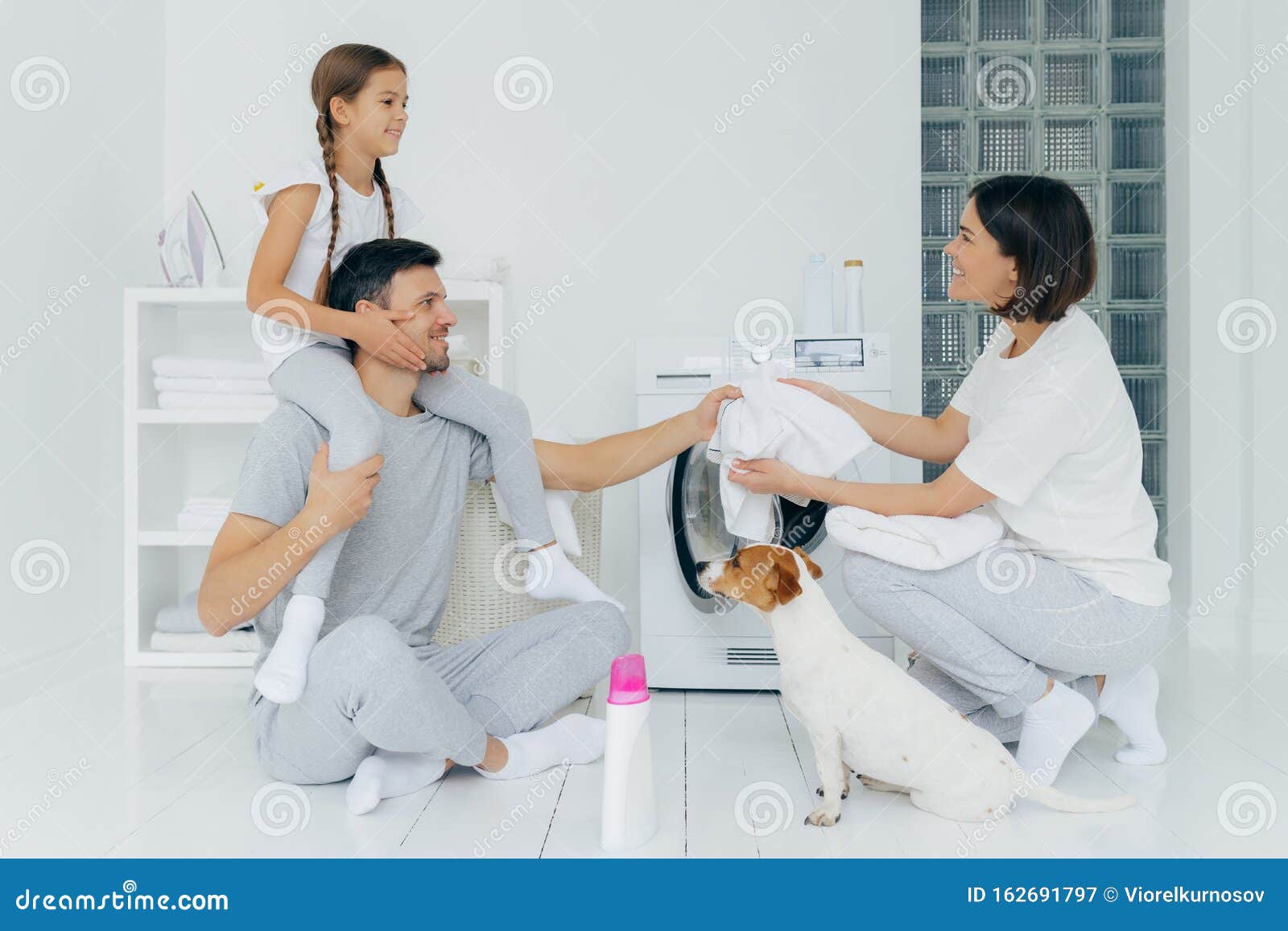 Horizontal Shot Of Little Girl Has Fun Together With Parents