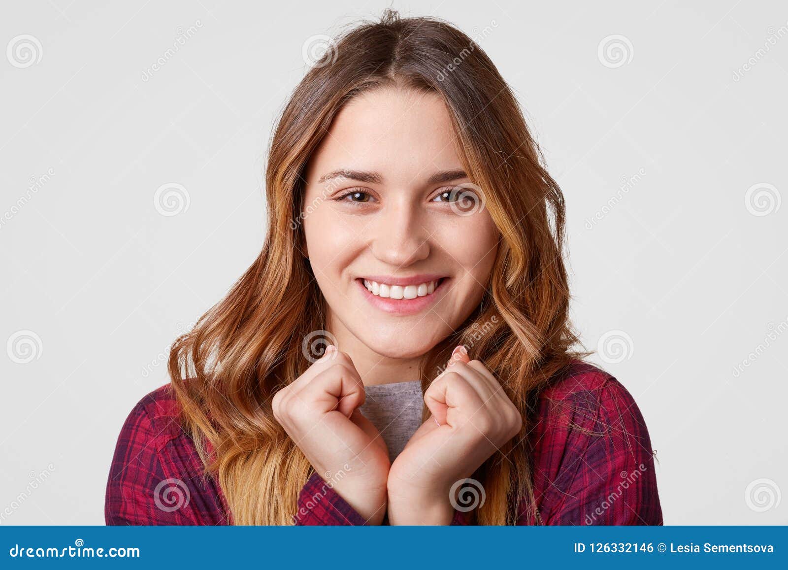 Horizontal Shot Of Pleasant Looking Caucasian Woman Has Charming Smile