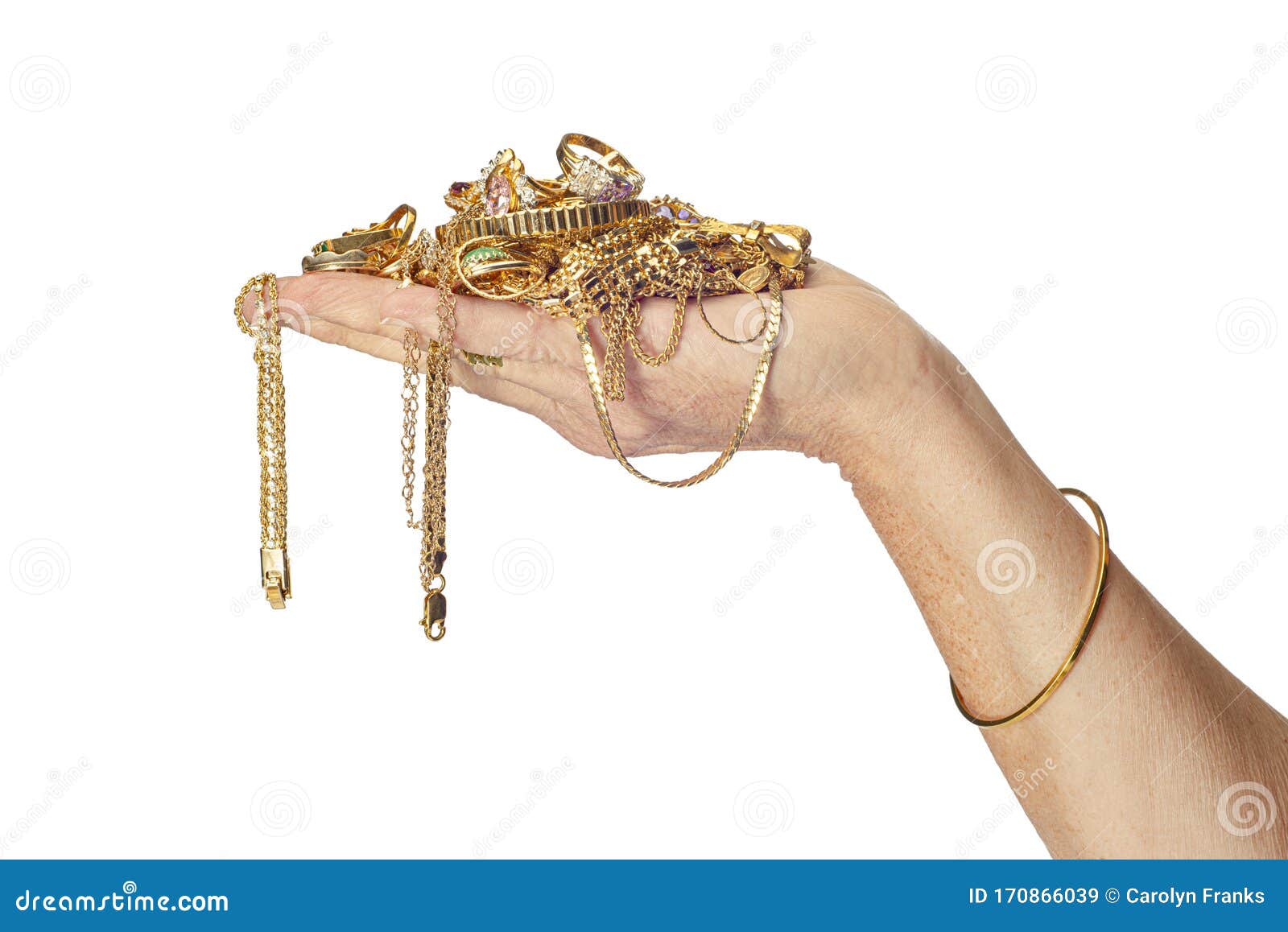hand holding gold jewelry