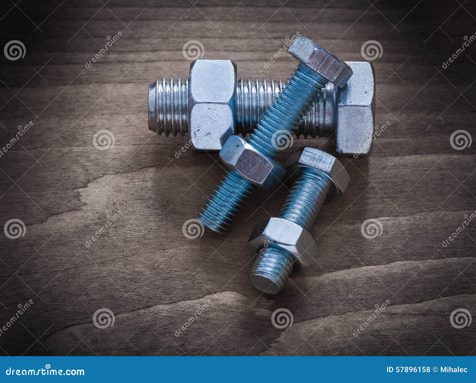 Horizontal Version of Construction Nuts Bolts on Vintage Wood Bo Stock