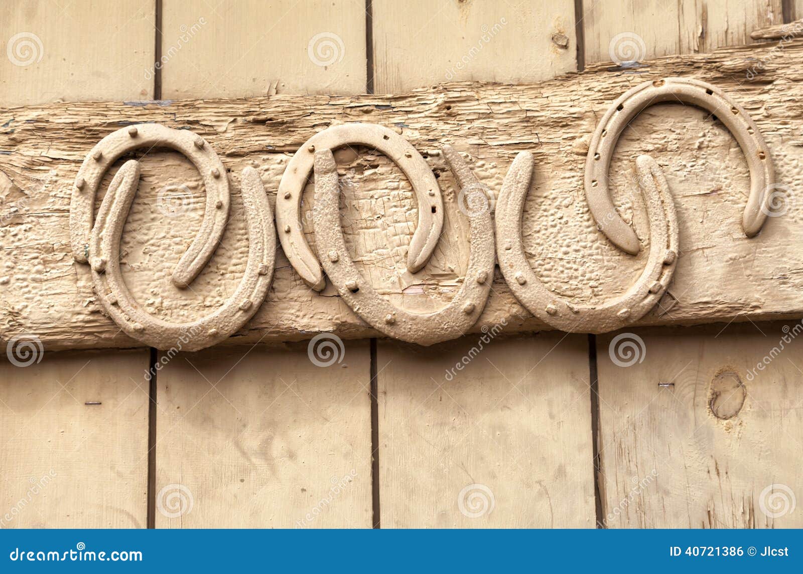 horse shoes nailed to old wooden door
