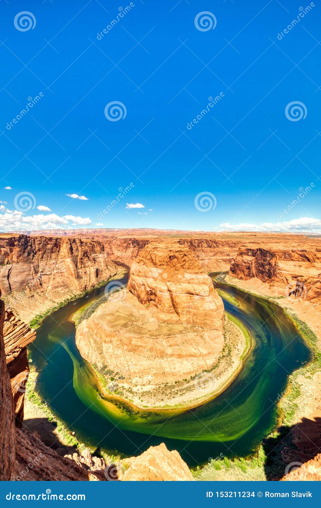Horseshoe Bend on Colorado River with Bright Blue Sky, Utah Stock Photo