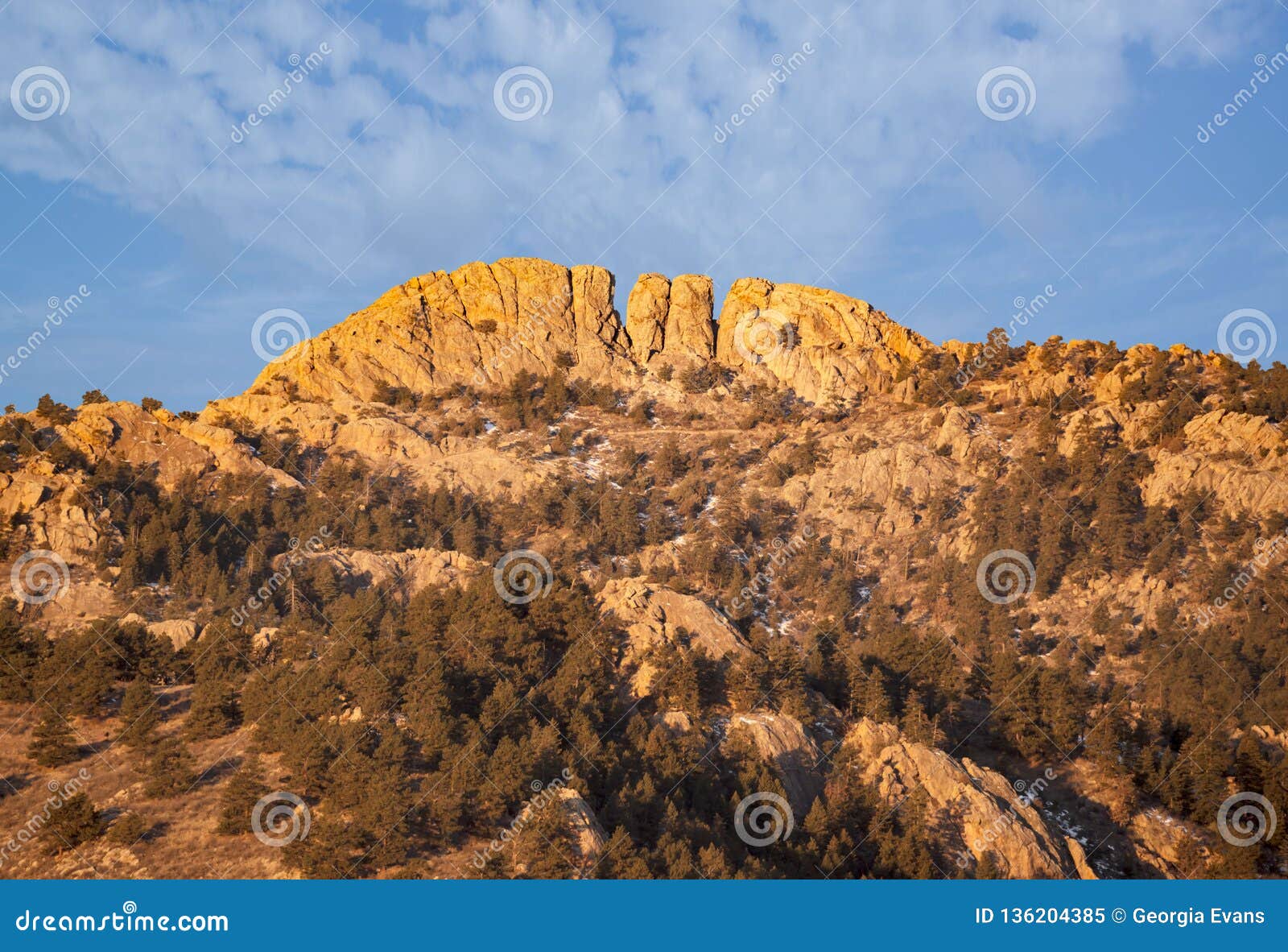 horsetooth rock formation at sunrise is a distinctive geological and popular mountain landmark overlooking fort collins,colorado